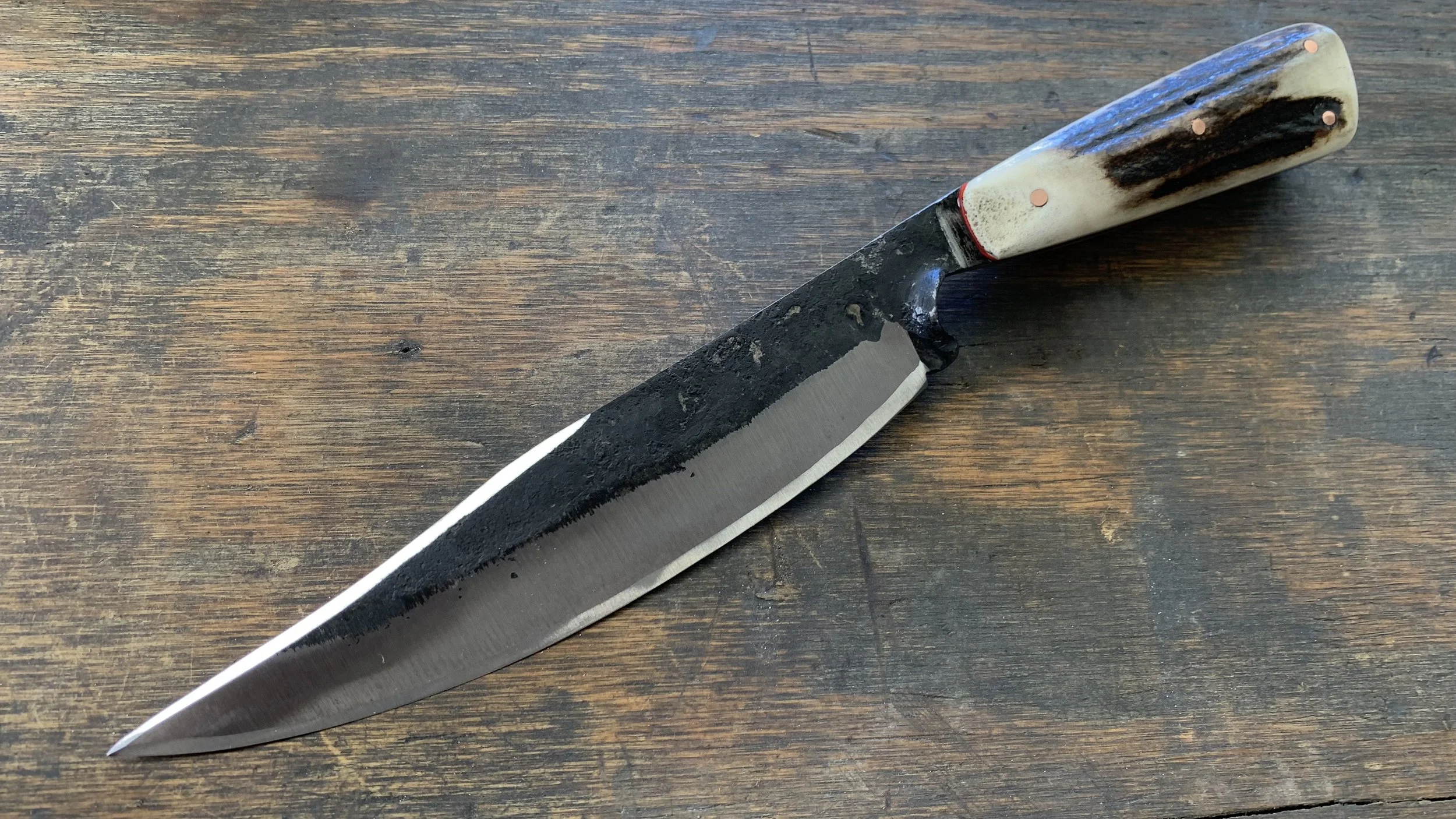 A large Brut de Forge knife made by M Wheeler.