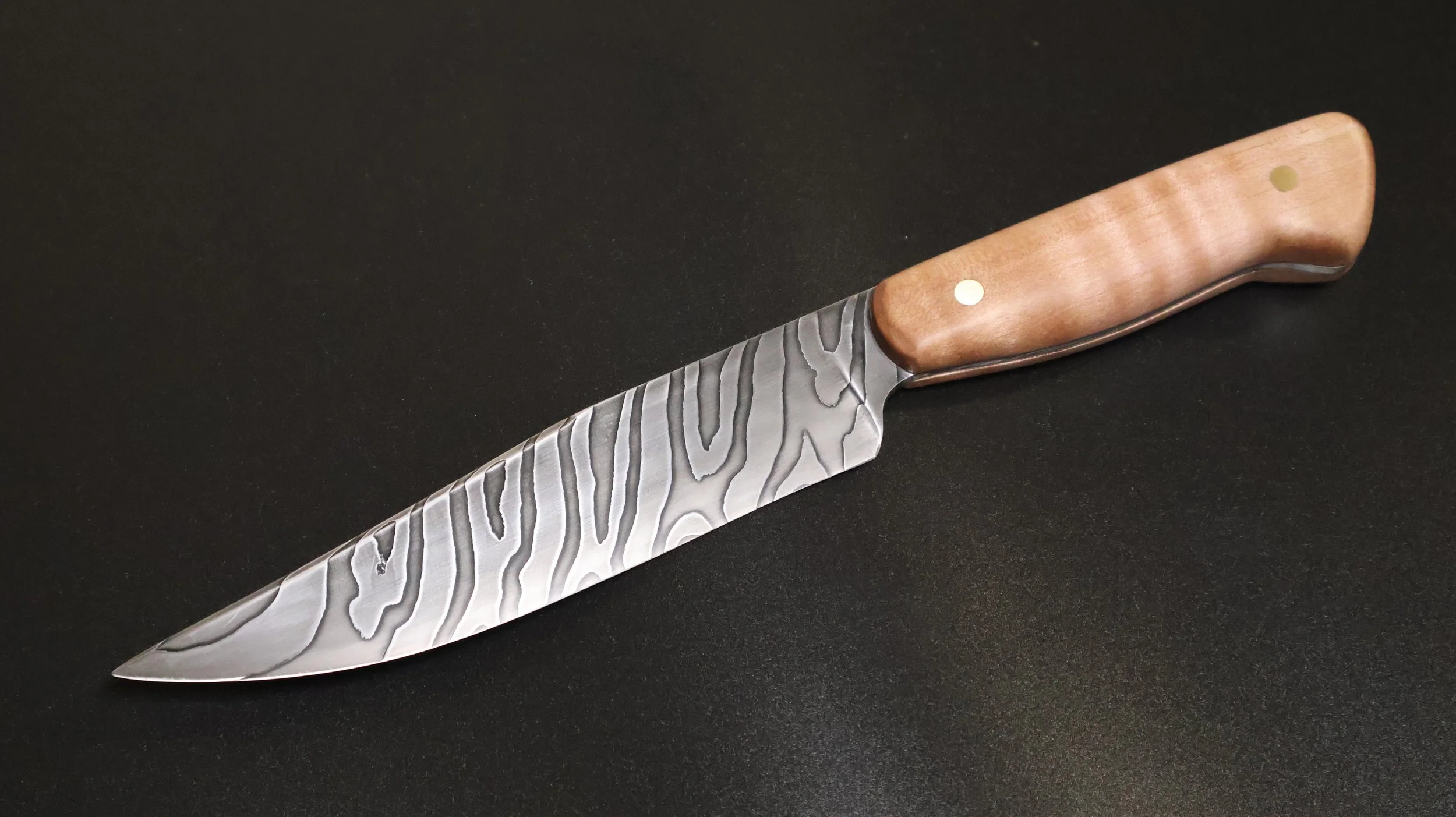 A twist Damascus knife by M Wheeler