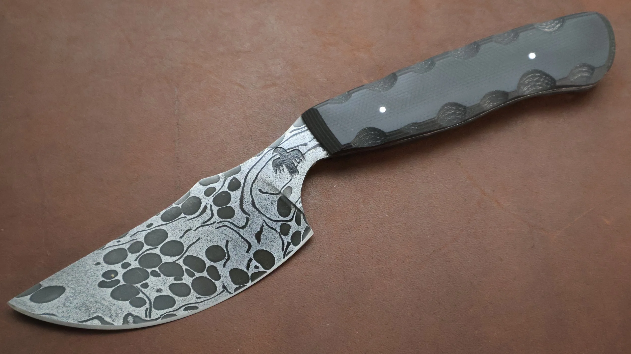 A Damascus skinning knife made by M Wheeler