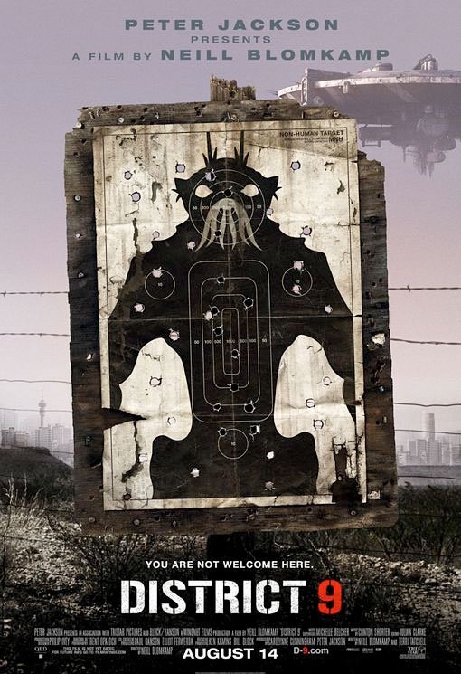 A gun target poster with a silhouette of a figure with a crown and spiky hair, featuring concentric target rings, over a weathered wooden background. The poster is for the movie 'District 9' directed by Neill Blomkamp, featuring text about the release date August 14 and the tagline 'You are not welcome here.'