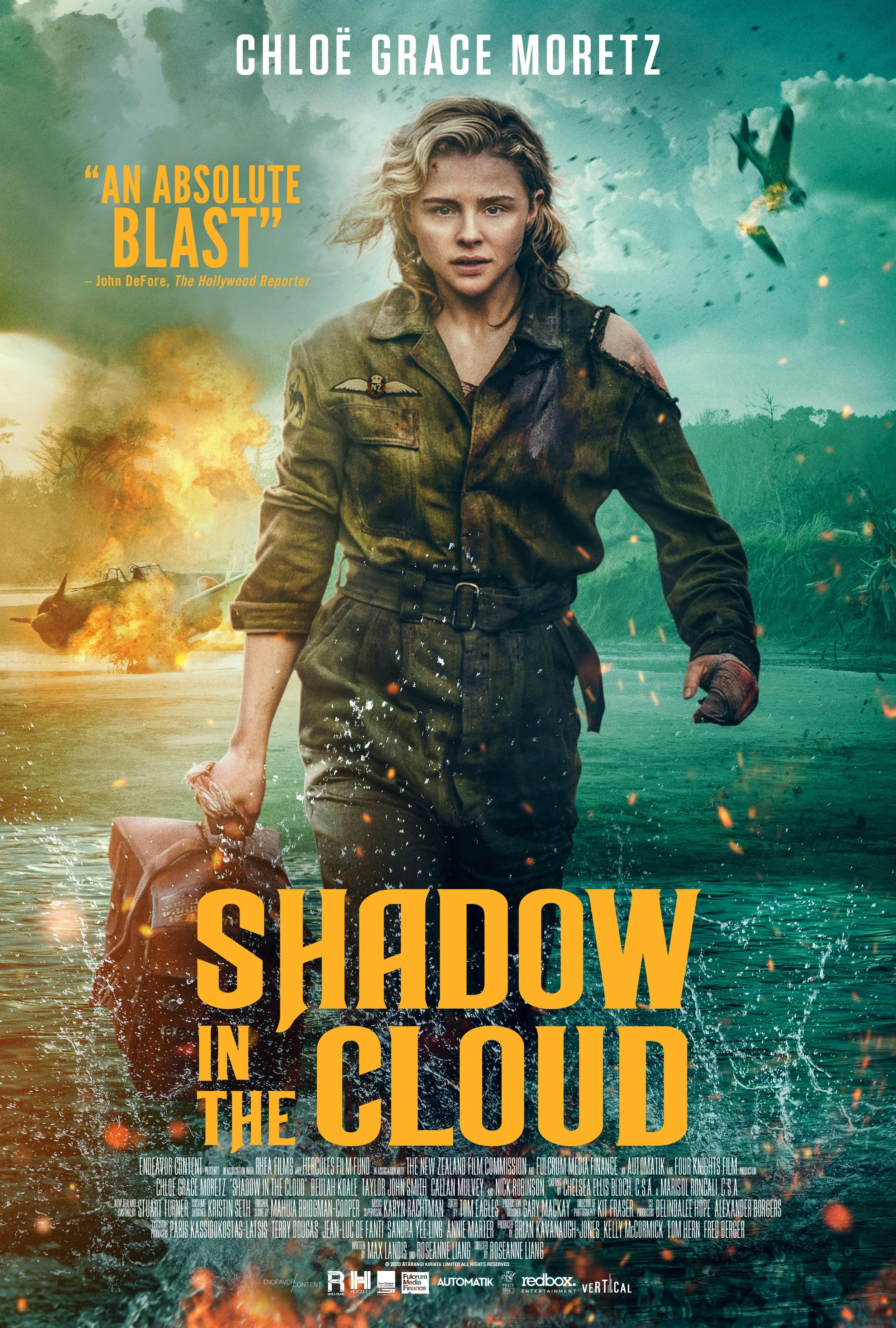 Movie poster for 'Shadow in the Cloud' featuring a woman in a military uniform walking through water with explosions and a plane in the background.