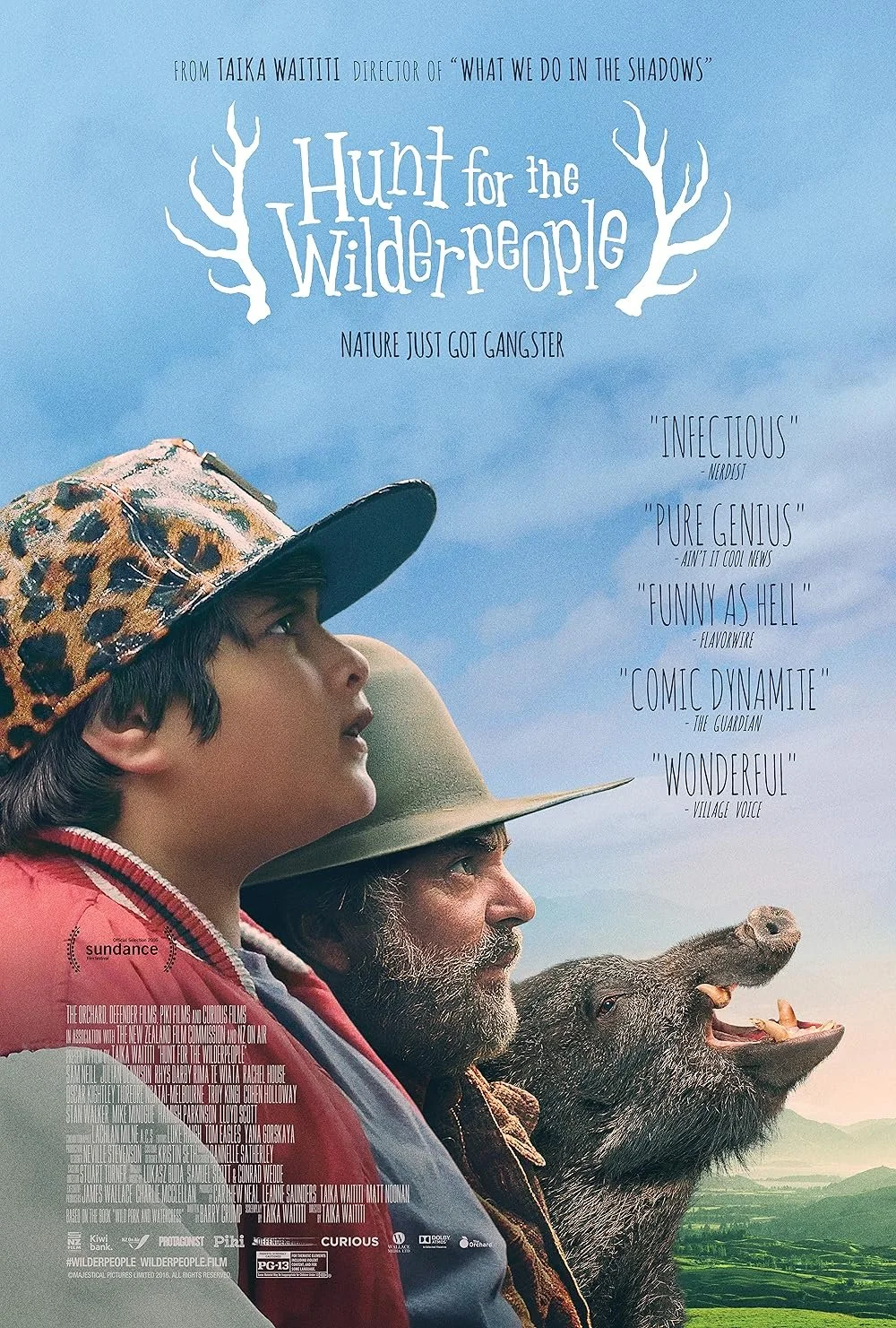 A movie poster for 'Hunt for the Wilderpeople' featuring two characters, a young boy and an older man, looking into the distance, with a wild boar's head next to them against a scenic landscape background.