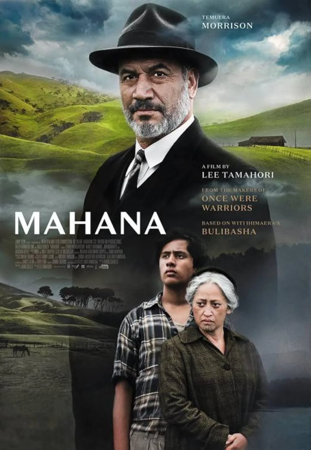 Movie poster for the film "Mahana" showing a large portrait of a man with a beard and hat at the top, a lush green landscape with hills and a house in the background, and two people—a young man and an elderly woman—in the foreground.