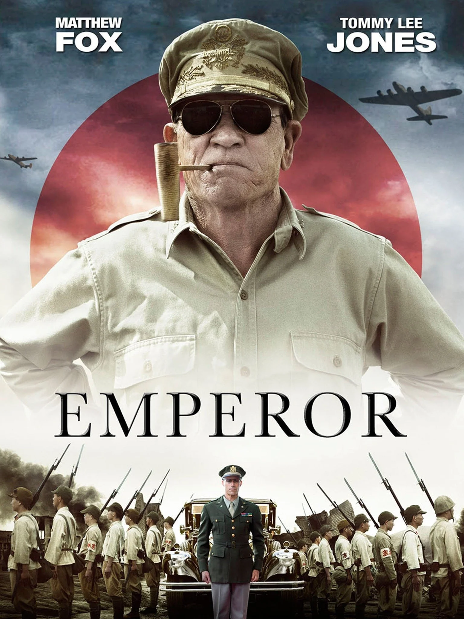Poster for the movie 'Emperor' showing a man in military uniform in front of a line of soldiers, with aircraft flying in the background and a large red circle. The names 'Matthew Fox' and 'Tommy Lee Jones' are at the top.
