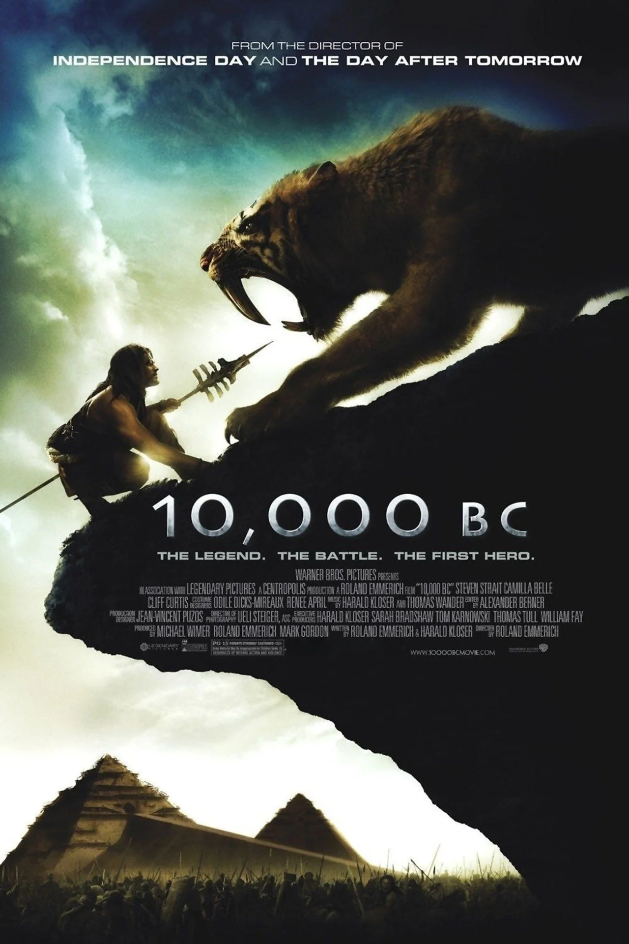 A promotional poster for the movie '10,000 BC' featuring a large saber-toothed tiger fighting a human warrior on a cliff, with pyramids and a crowd of people in the background, and text highlighting the film's theme of legend, battle, and heroism.