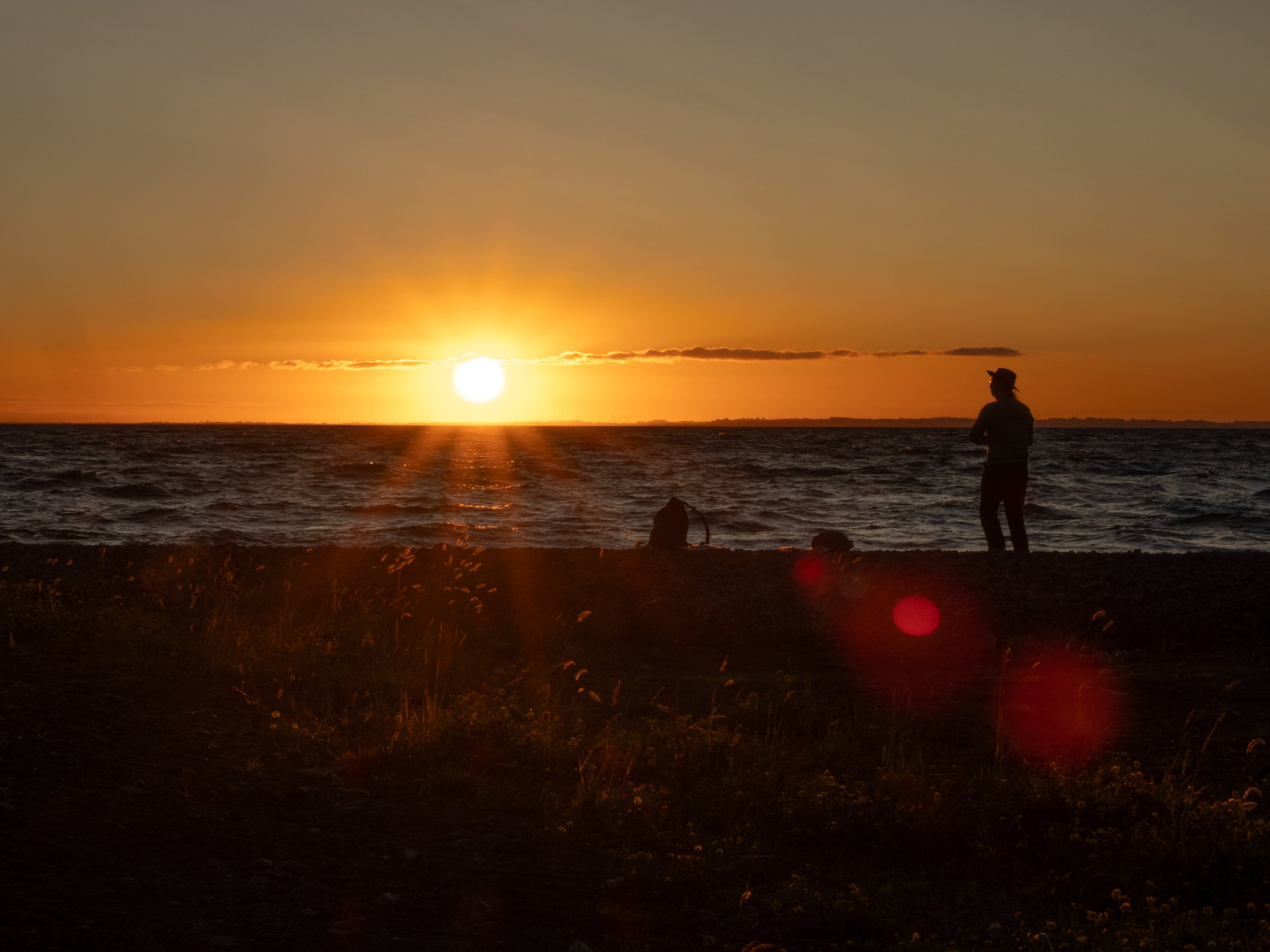 A fisherman catches the last rays of the sun on Lago Llanquihue.