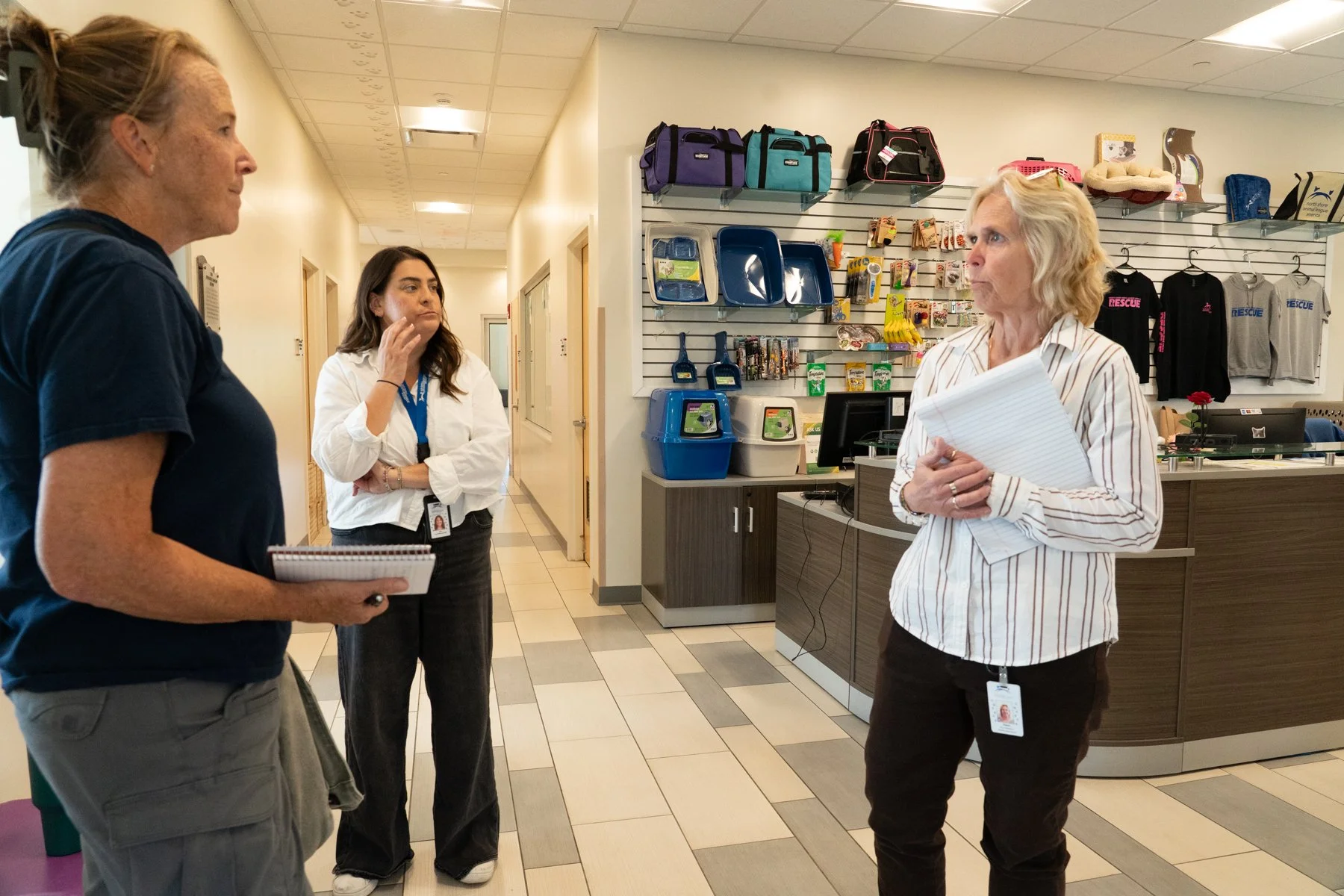 staff discussing animal relocation program at rescue facility