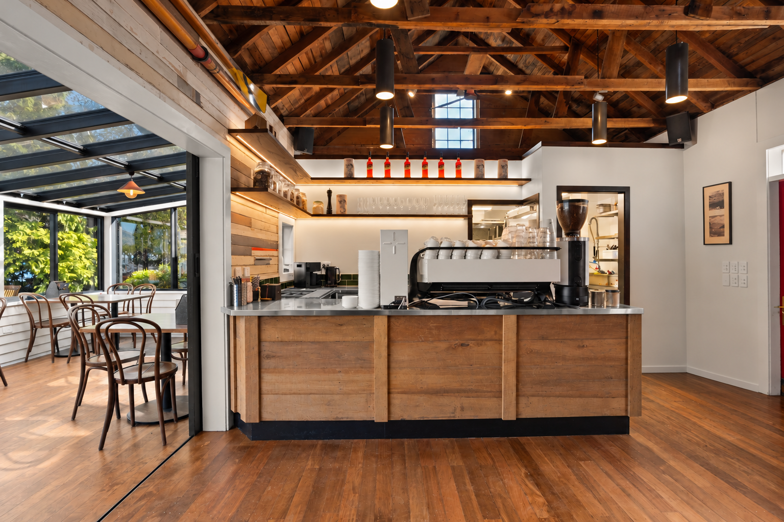 Cafe coffee bar with custom timber counter and exposed rafters, Boat Shed Cafe renovation
