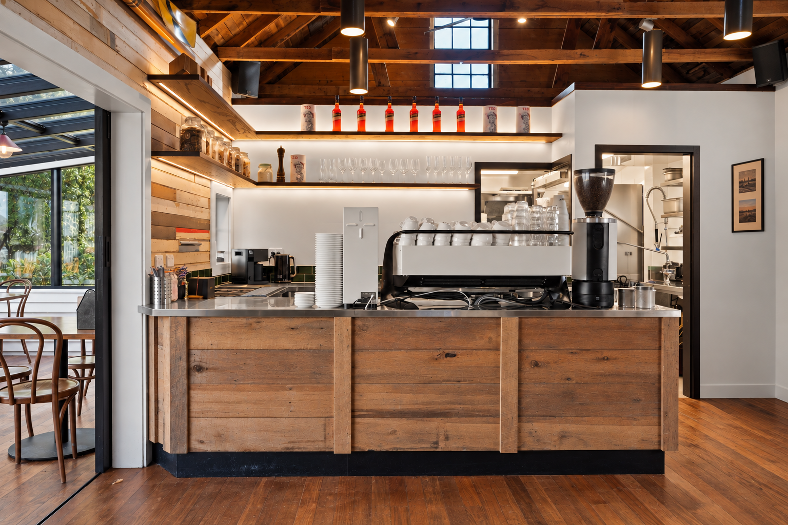 Espresso machine and coffee station beneath heritage timber rafters, Boat Shed Cafe