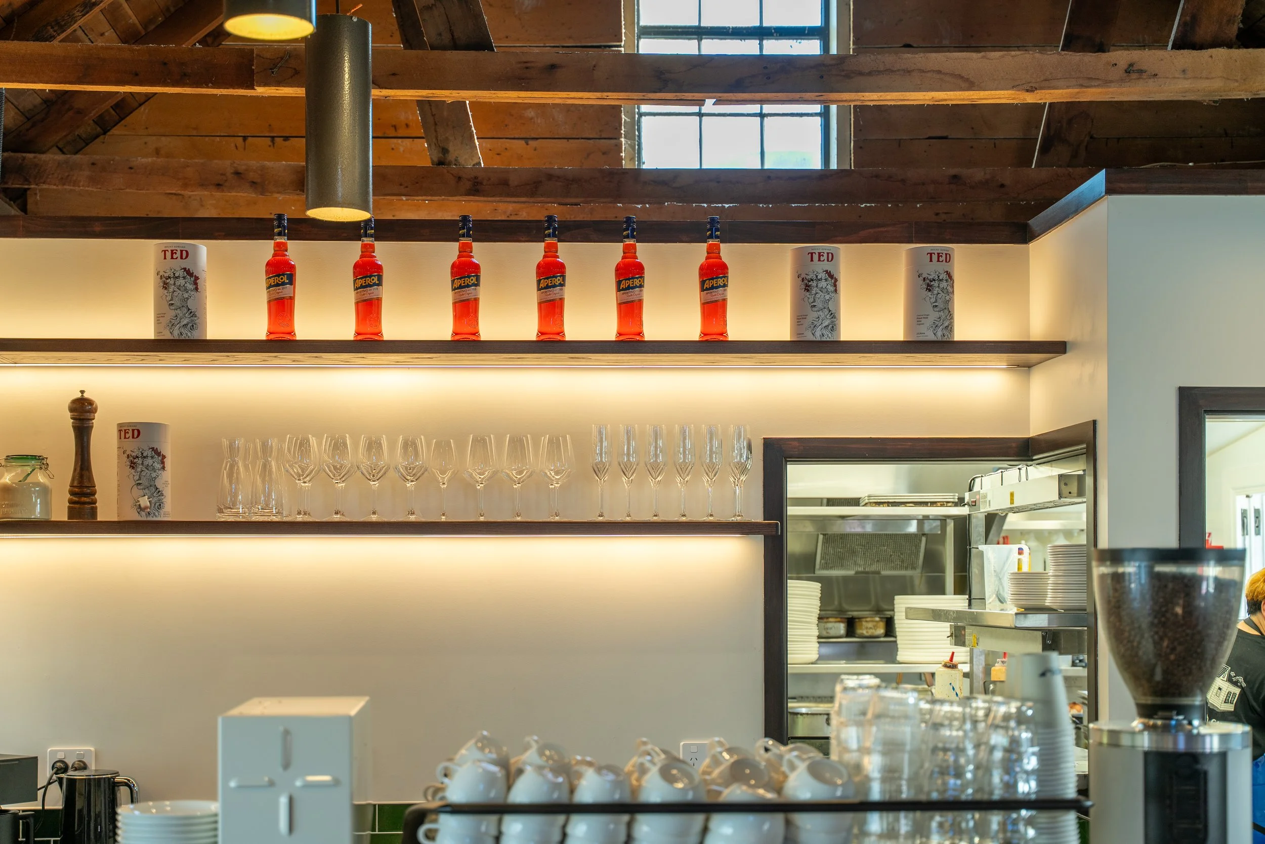 Back bar shelving with glassware and feature lighting, Boat Shed Cafe fit-out