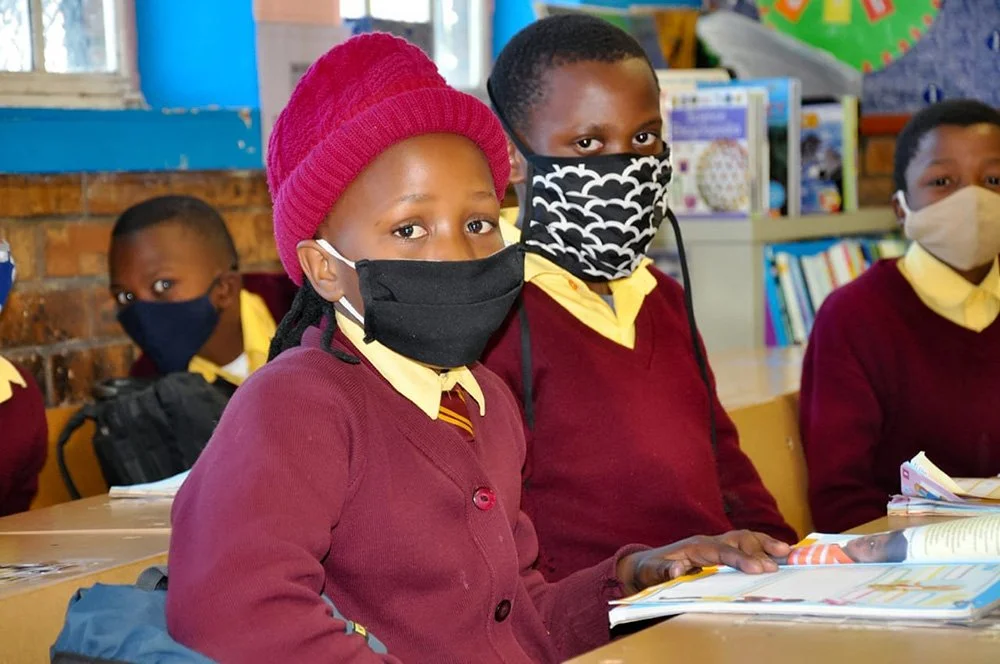 Students enjoying the donated school supplies from COSAS at Sonwabo Primary School