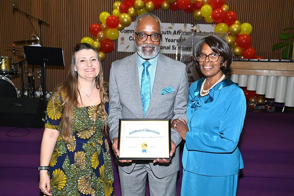 Bishop Johnathan Logan (center) and Dr. Carolyn L. J. Logan (right) receive a certificate of appreciation from COSAS Operations Manager Nicole Richards (left) at COSAS' 31st Anniversary Dinner.