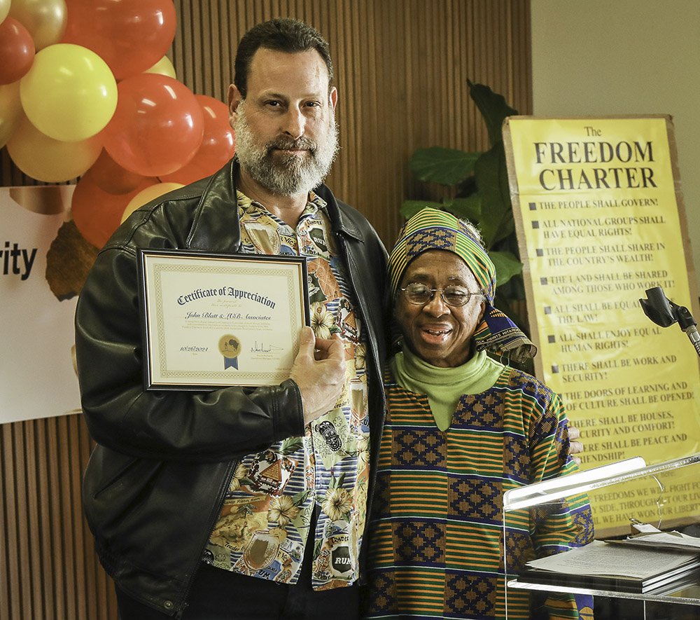 (Left to right) COSAS supporter John Blatt  and COSAS member Adele Ahanotu at COSAS' 31st Anniversary Dinner.