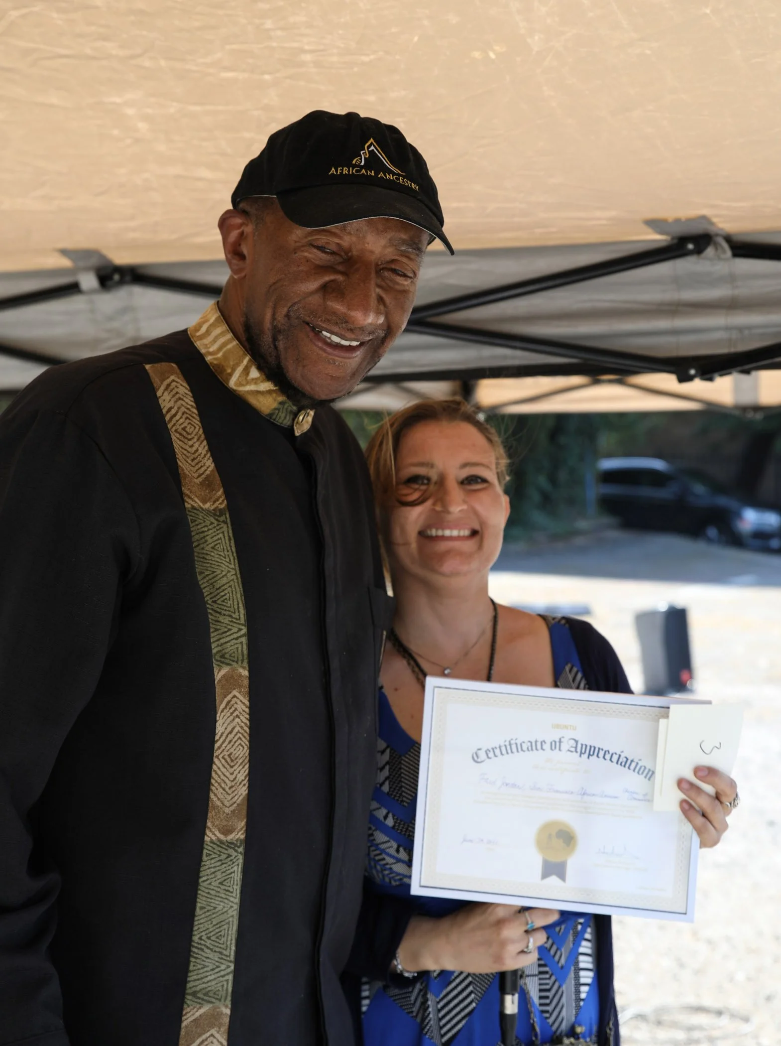 (Left to right) COSAS Board of Directors member Frederick Jordan, P.E., also the San Francisco African American Chamber of Commerce (SFAACC) Chairman of the Board, receives a certificate of appreciation from COSAS Operations Manager Nicole Richards a