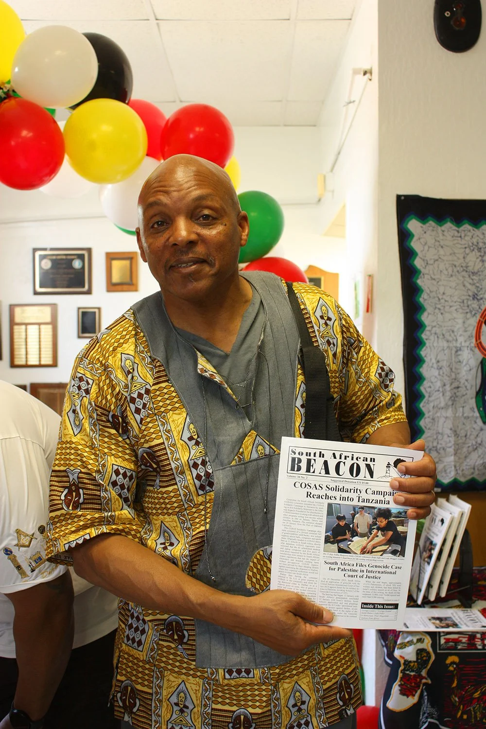 COSAS Board of Directors member Carlos Webster holding a copy of  South African BEACON