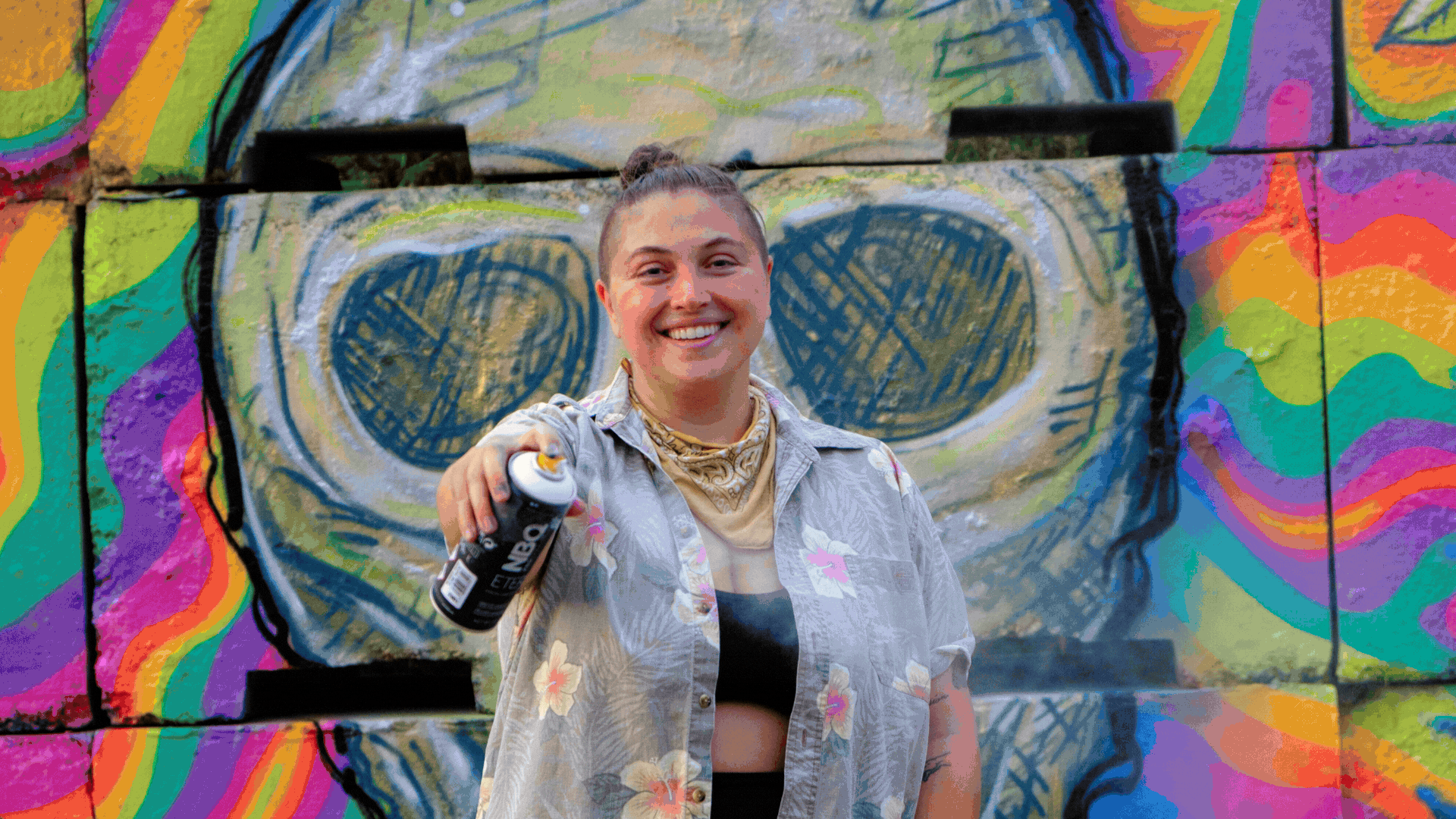 A repeating GIF composed of images of colorful murals of Emily Paige Armstrongs, as well as images of her working on murals, live paintings and public art.