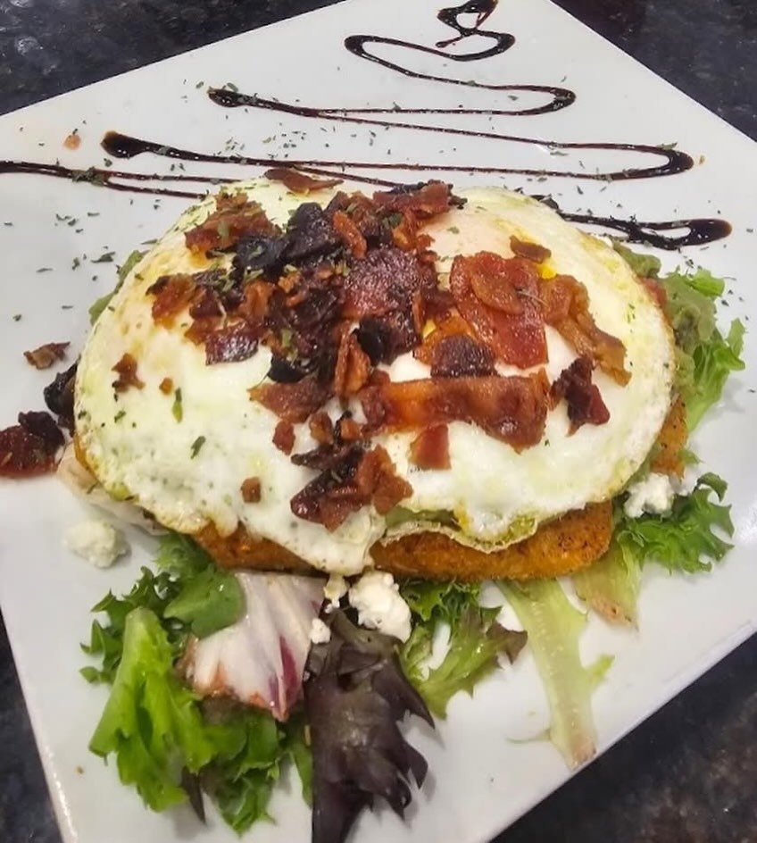 Not Your Basic Bit$&amp;
Our spin on the way too common Avocado toast 
Crunchy hashbrowns seasoned and layered with avocado, house pico, feta crumbles, runny eggs and bacon crumbles on a bed of spring mix garnished with balsamic reduction. 🥑🍳
🍸Enj