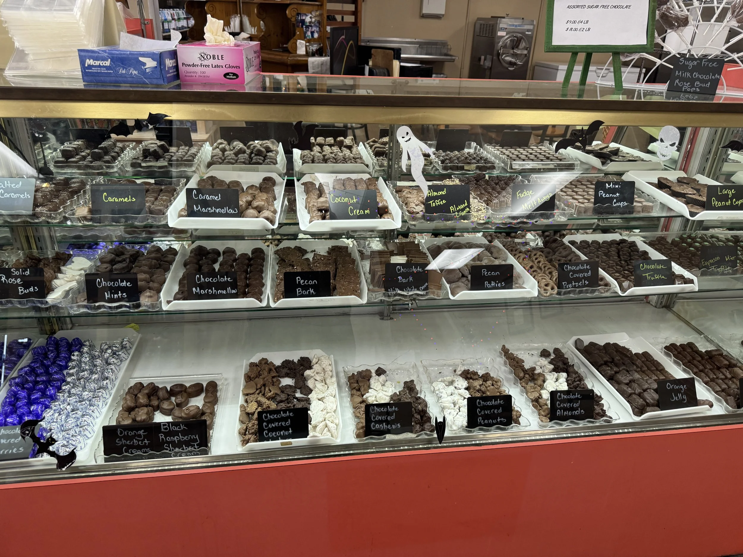 Display case filled with handmade chocolates and assorted candies at Webb’s Candy Store in Florida.