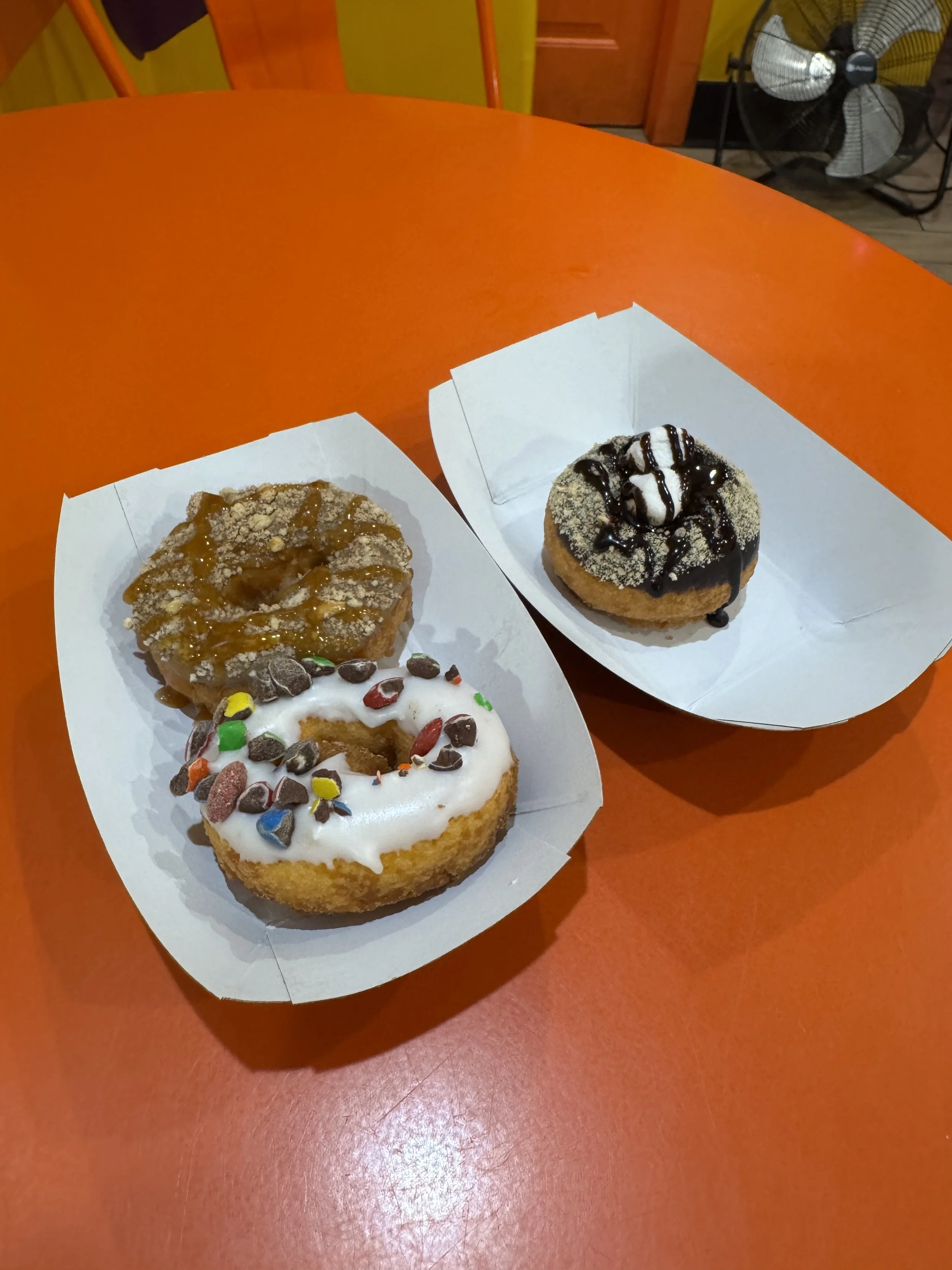 Assorted mini donuts with toppings served at Peace, Love and Little Donuts in St. Augustine.