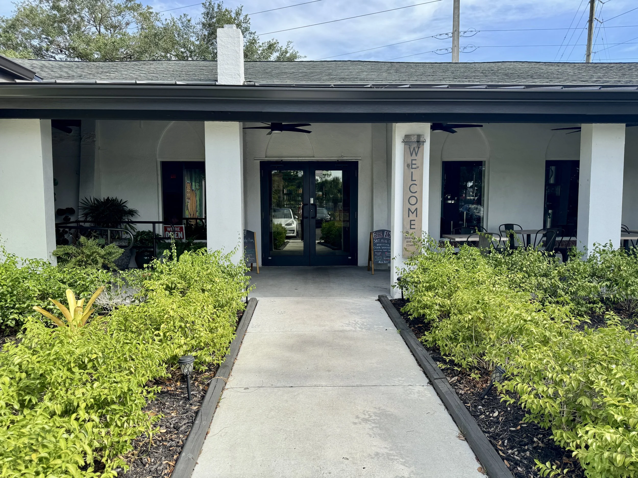 Exterior entrance of Swamp Cat Brewery located in converted church in Fort Myers Florida