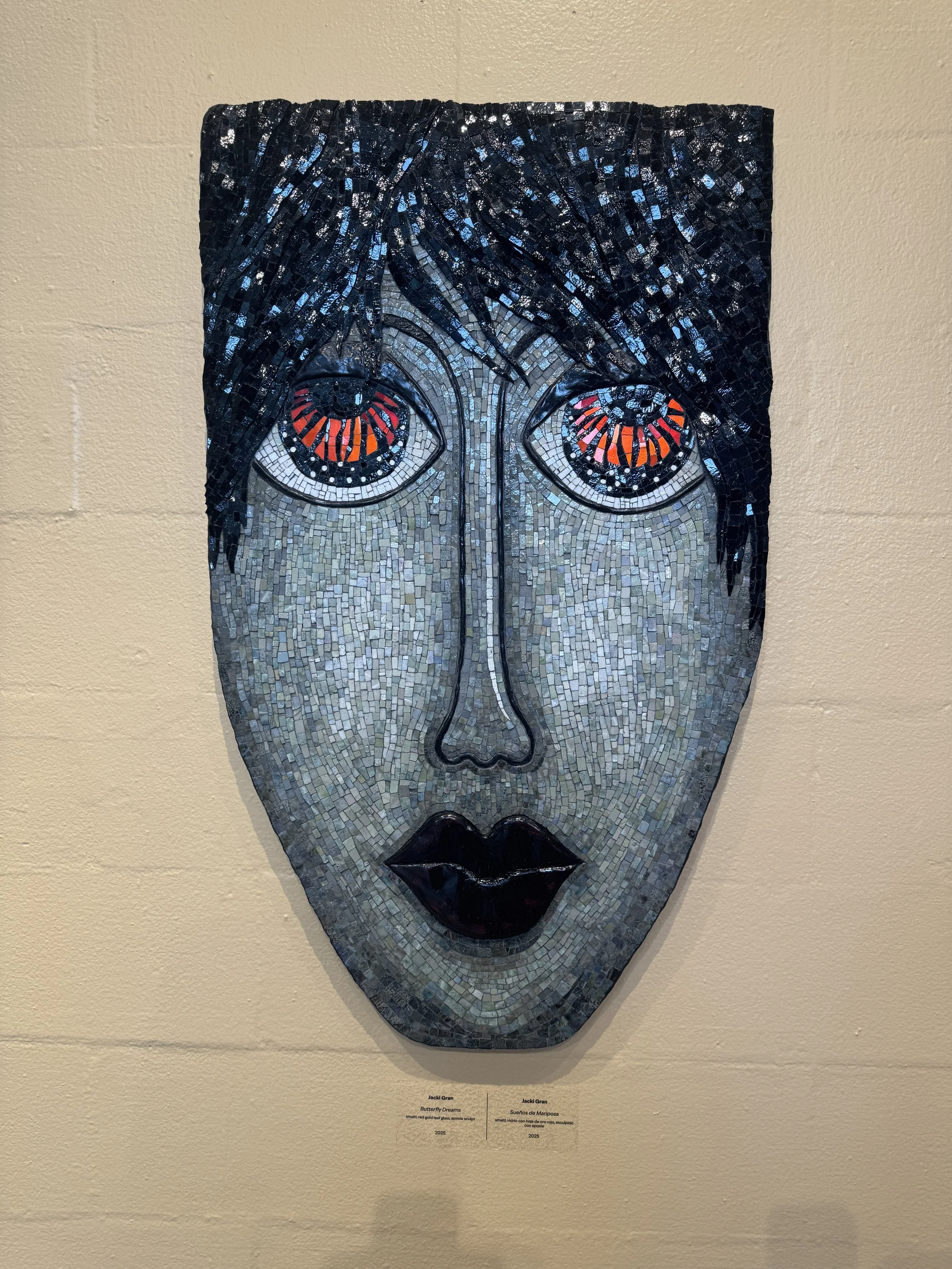 Decorative mosaic mask artwork displayed inside the Albin Polasek Museum in Winter Park Florida.