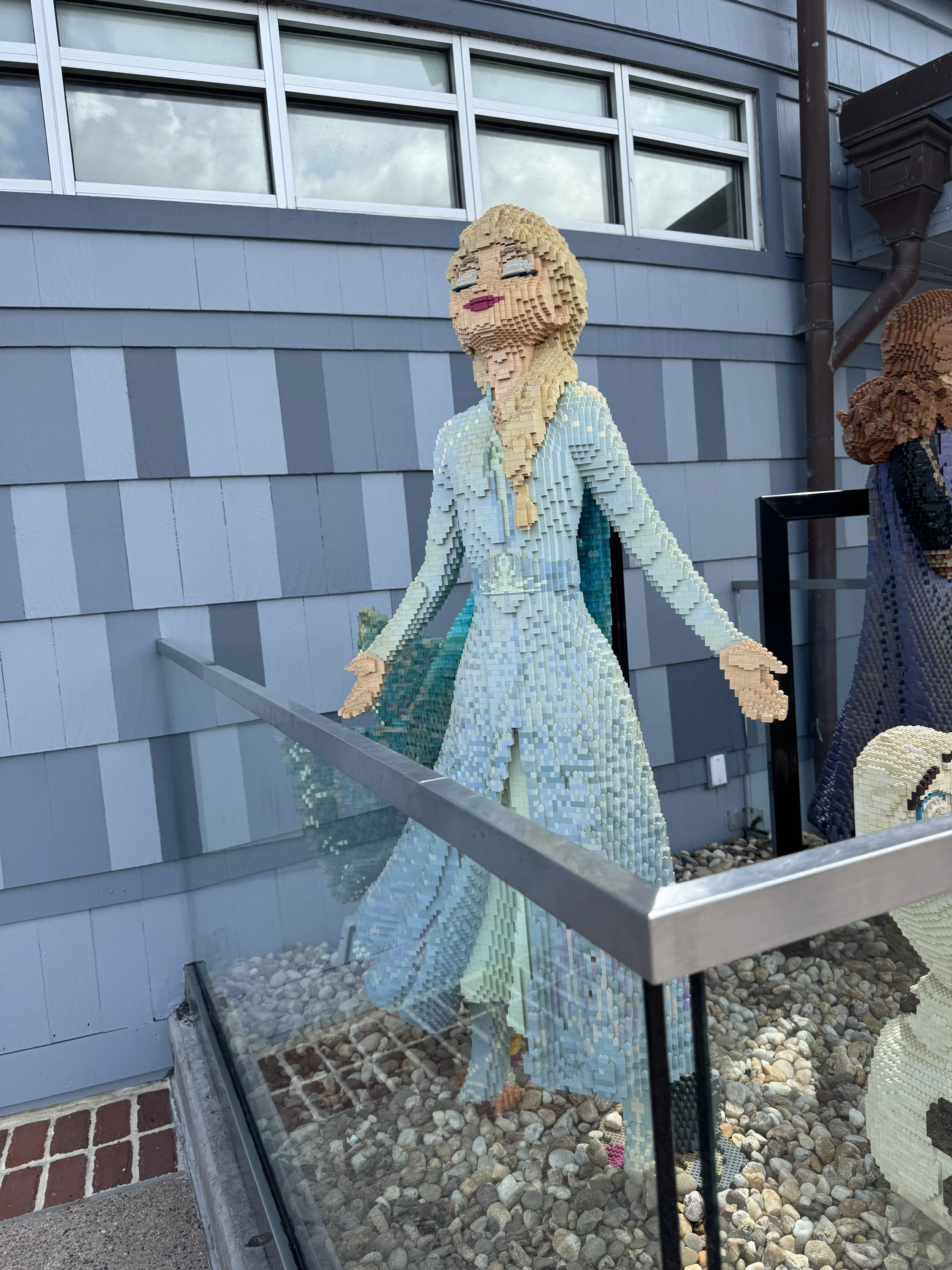 Large LEGO sculpture of Elsa from Frozen outside the LEGO Store at Disney Springs.