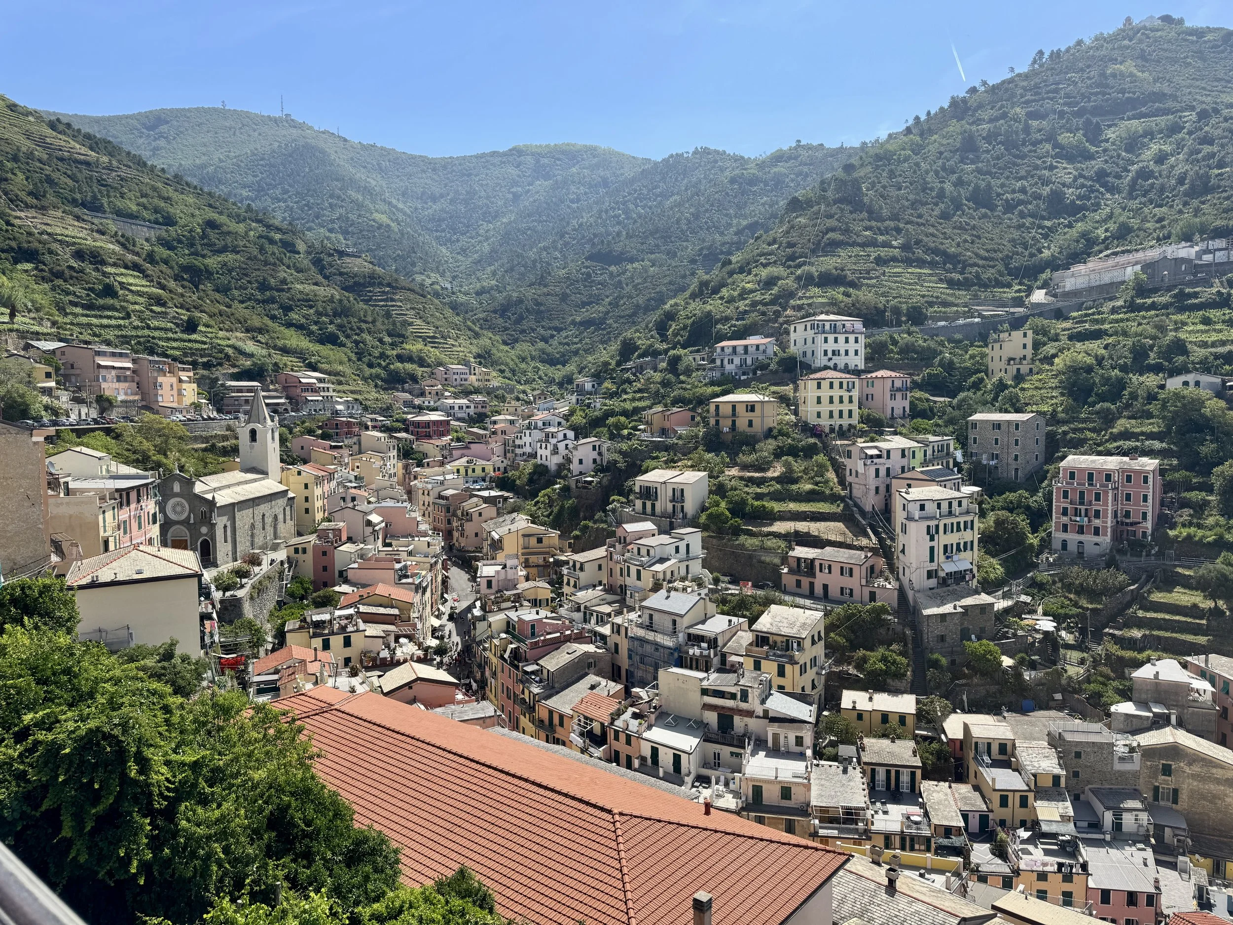Mountain village and green valley in Northern Italy, featured in a 10-day Italy road trip itinerary.