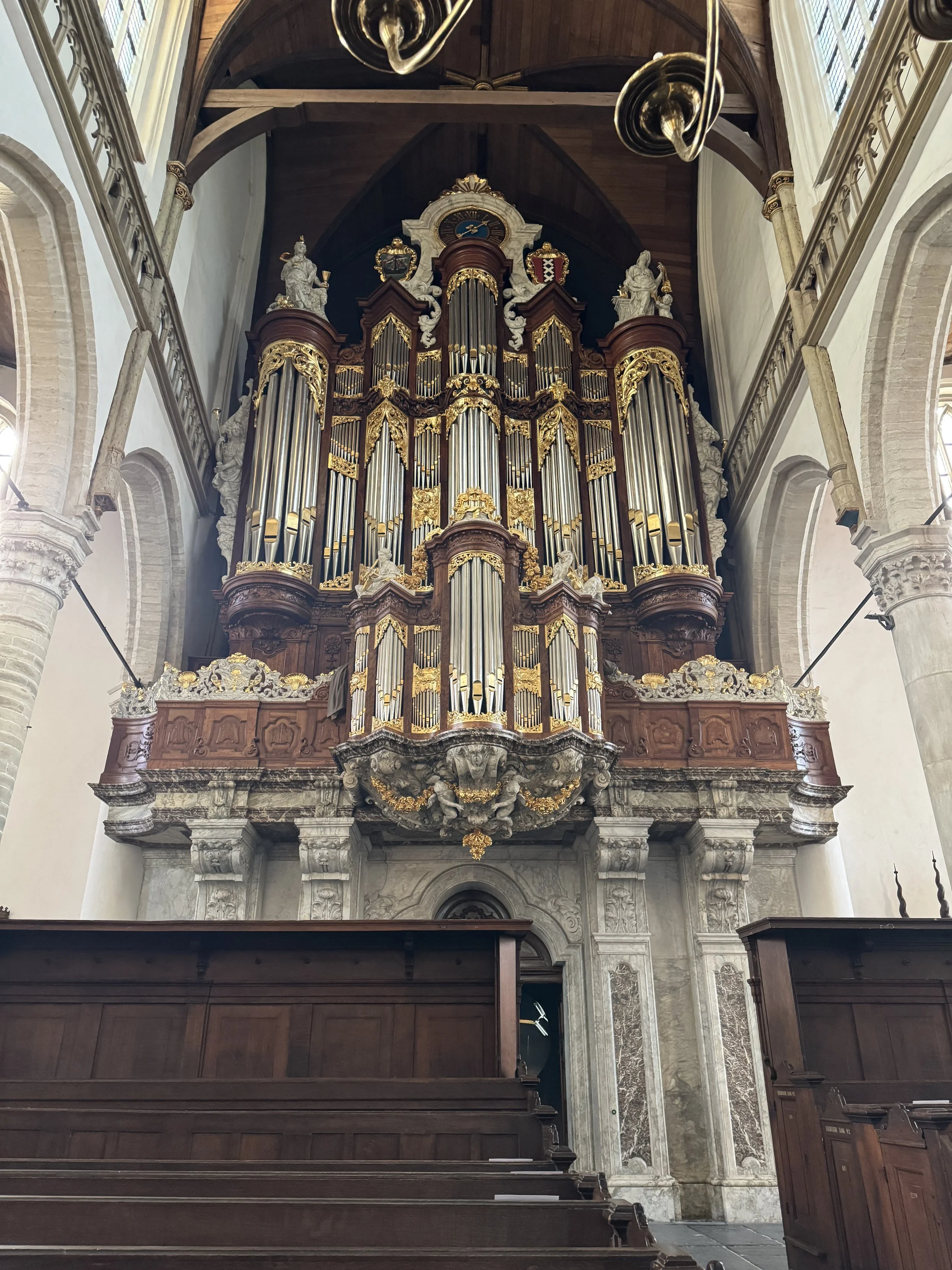 Large historic pipe organ inside Oude Kerk church in Amsterdam