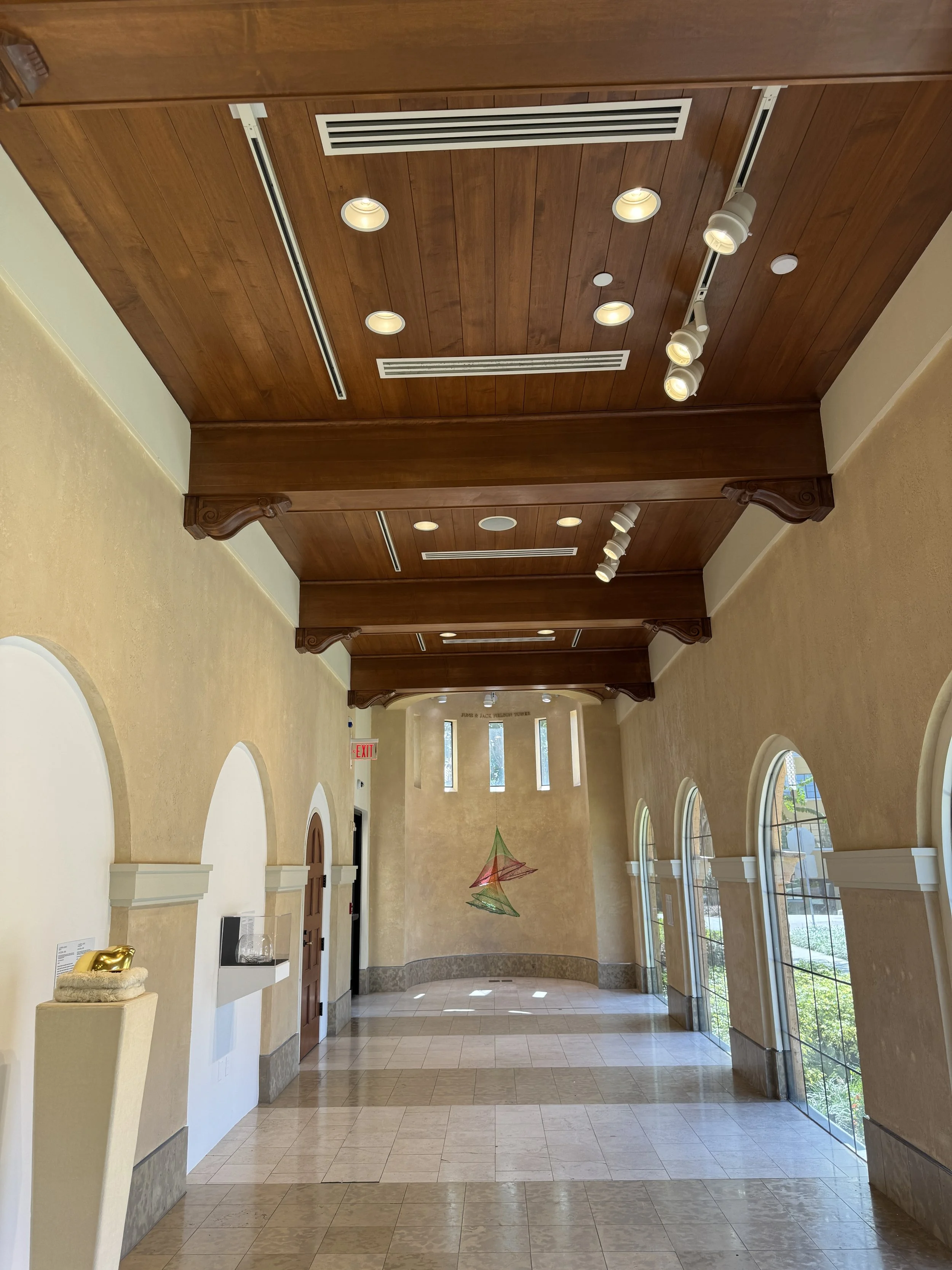 Interior hallway and gallery space inside the Rollins Museum of Art at Rollins University.