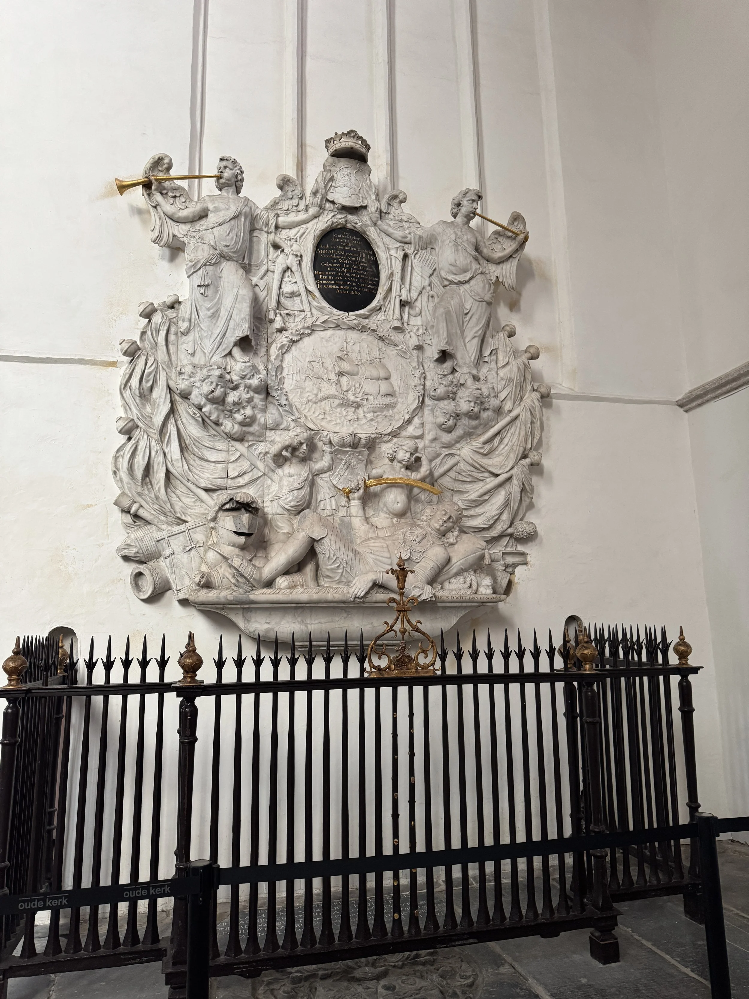 Ornate wall memorial sculpture inside Oude Kerk in Amsterdam
