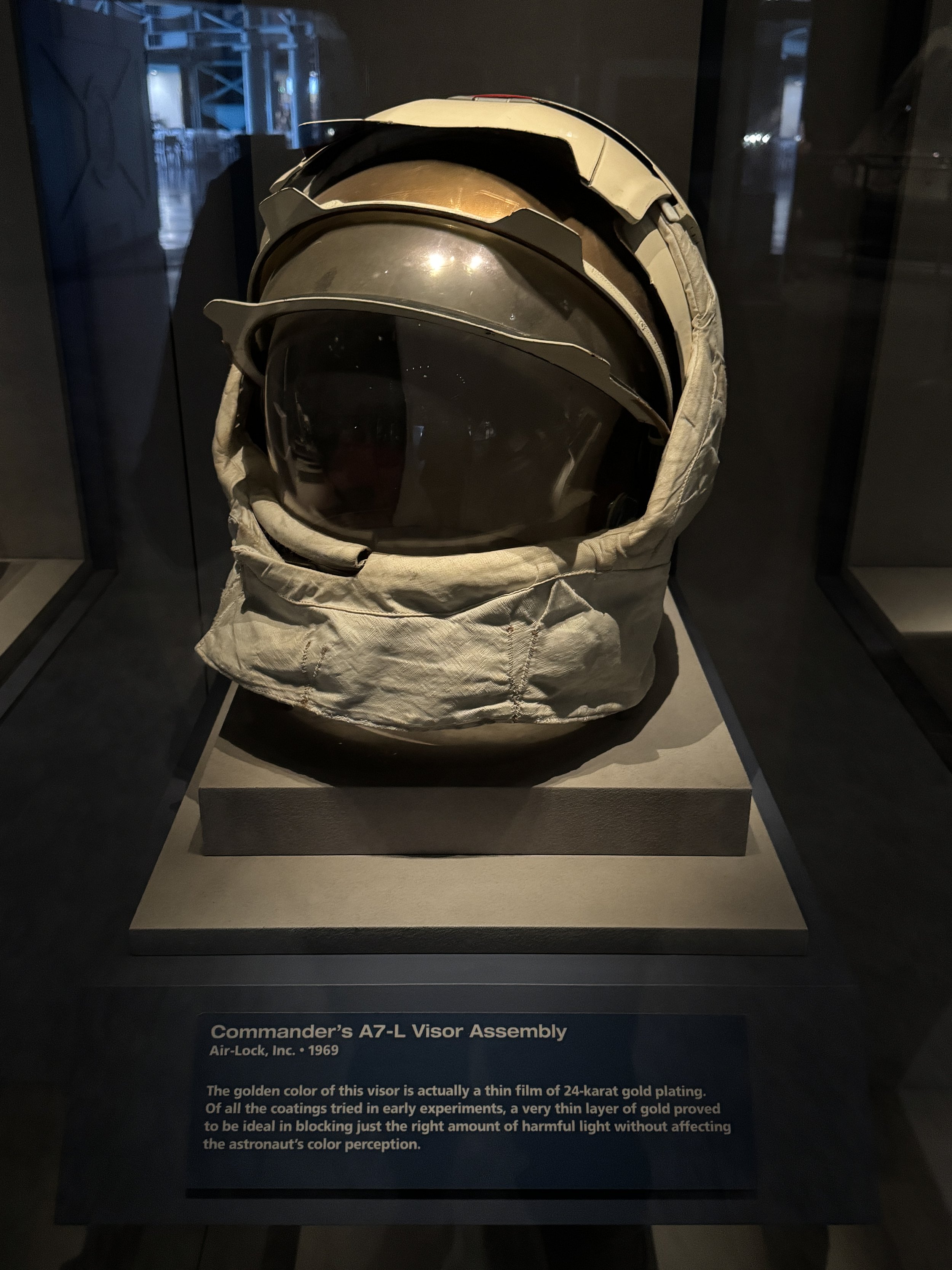 Apollo-era astronaut helmet displayed in an exhibit at Kennedy Space Center.