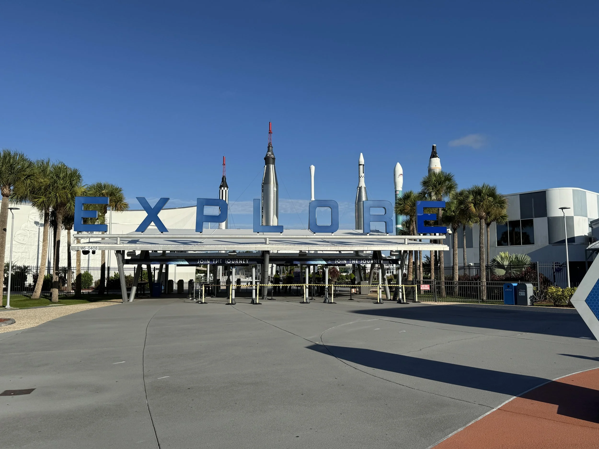Entrance plaza to the Kennedy Space Center Visitor Complex with the Explore sign in Cape Canaveral, Florida.