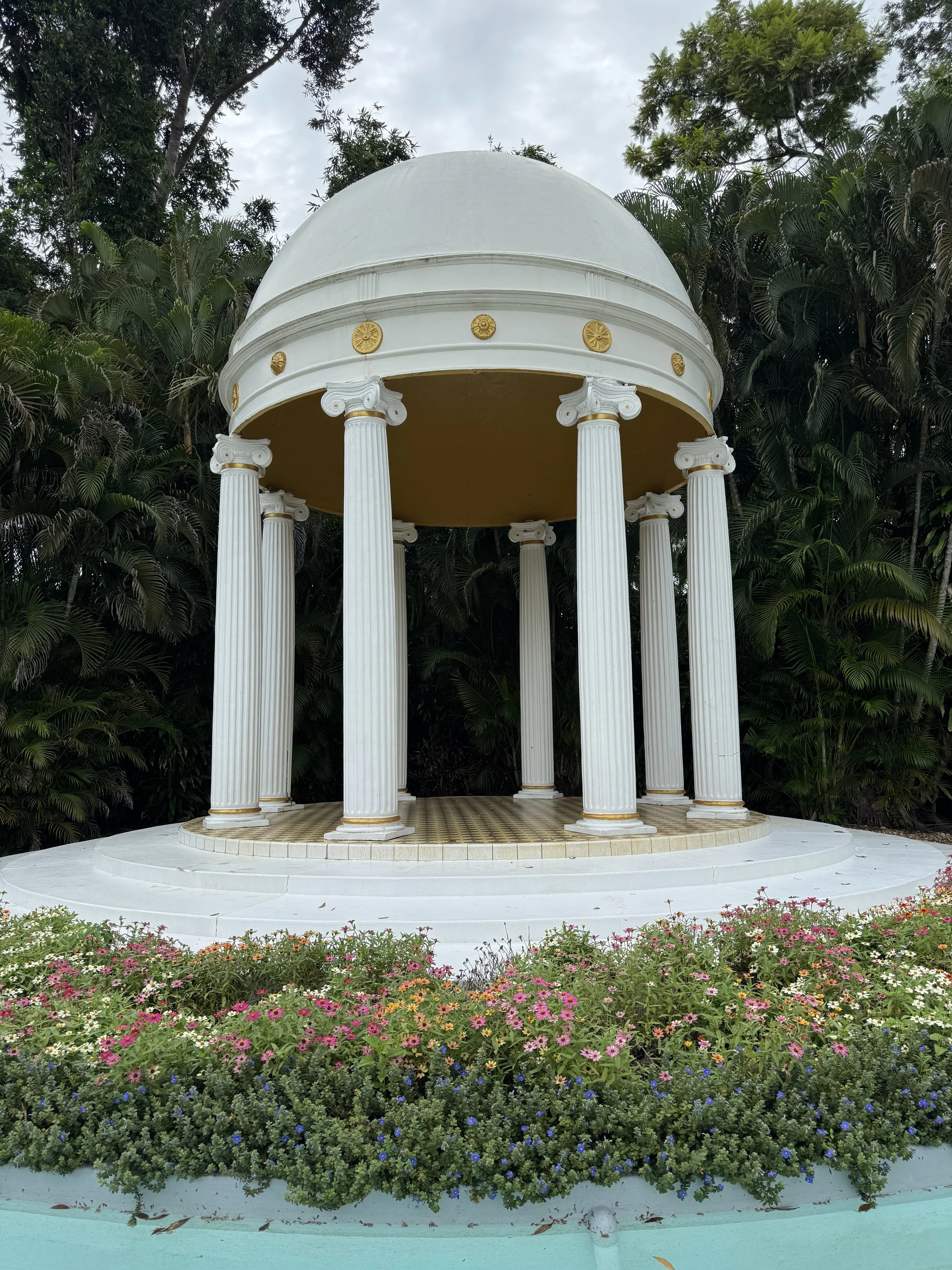 historic white columned alter pavilion surrounded by flowers at Legoland Florida in Winter Haven