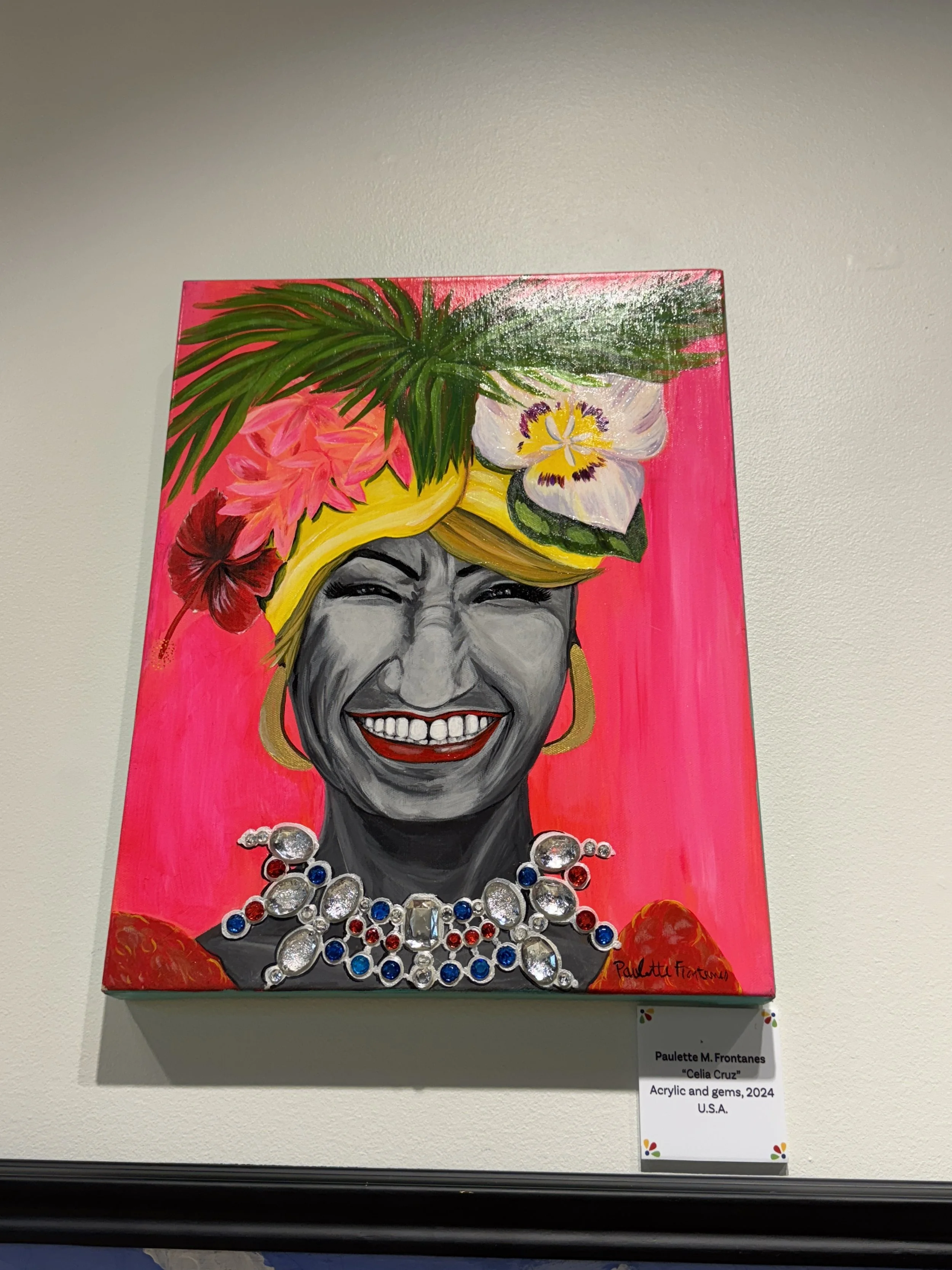 Colorful portrait artwork displayed in the art gallery at Orlando International Airport.
