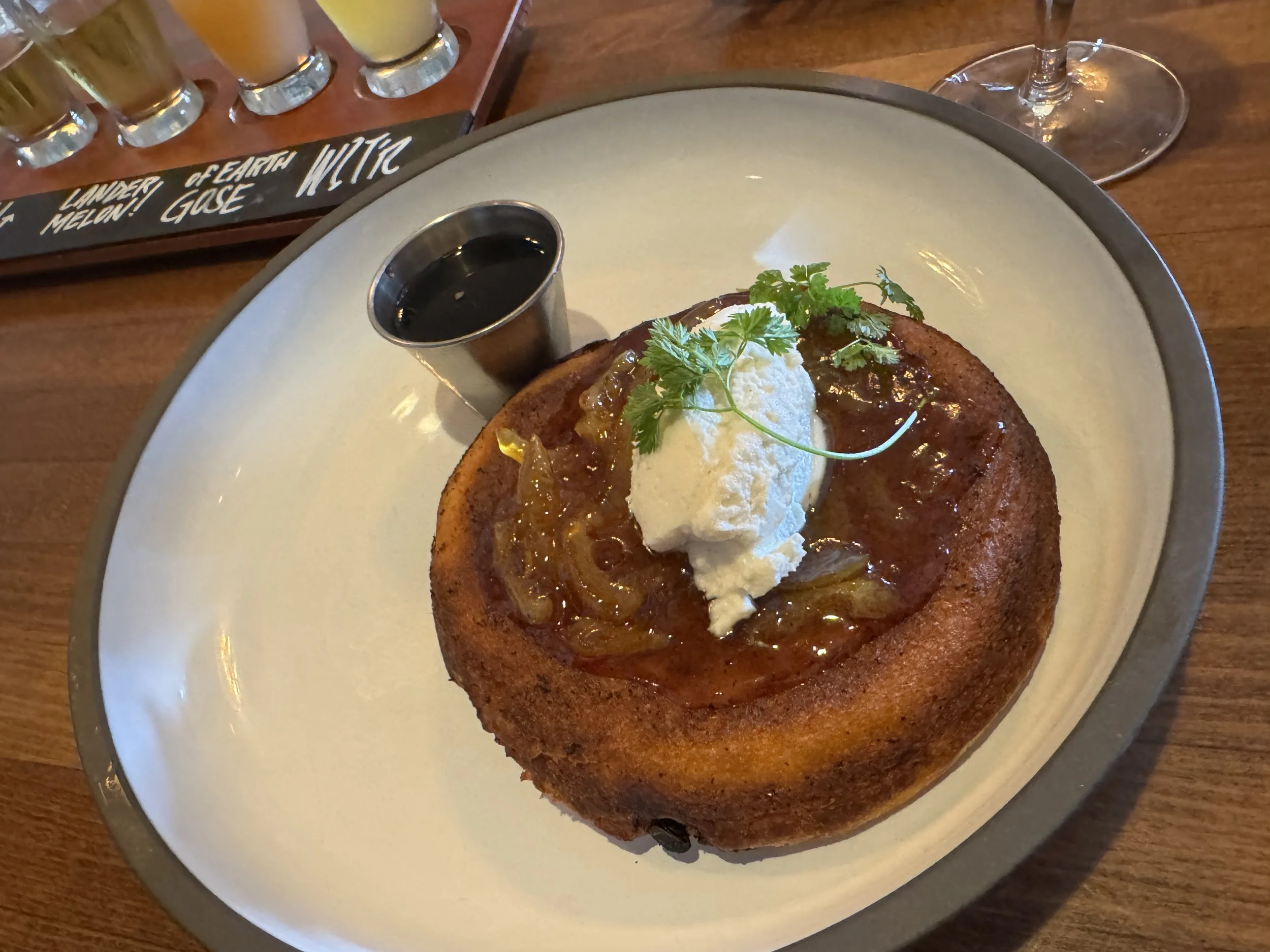 Dutch baby pancake topped with cream and berries served at The Ravenous Pig in Winter Park Florida.