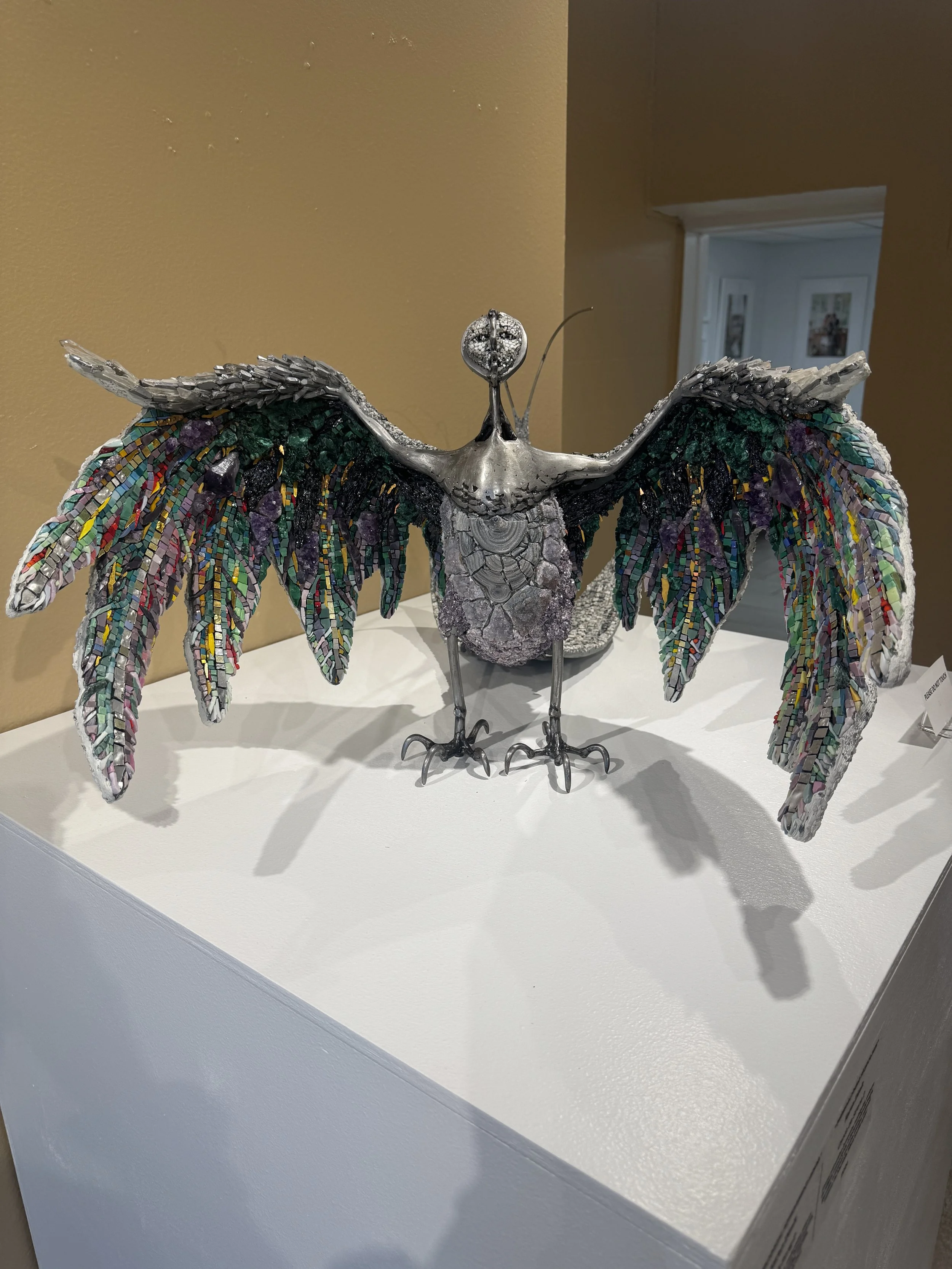 Metal winged sculpture displayed inside the Albin Polasek Museum & Sculpture Gardens gallery.