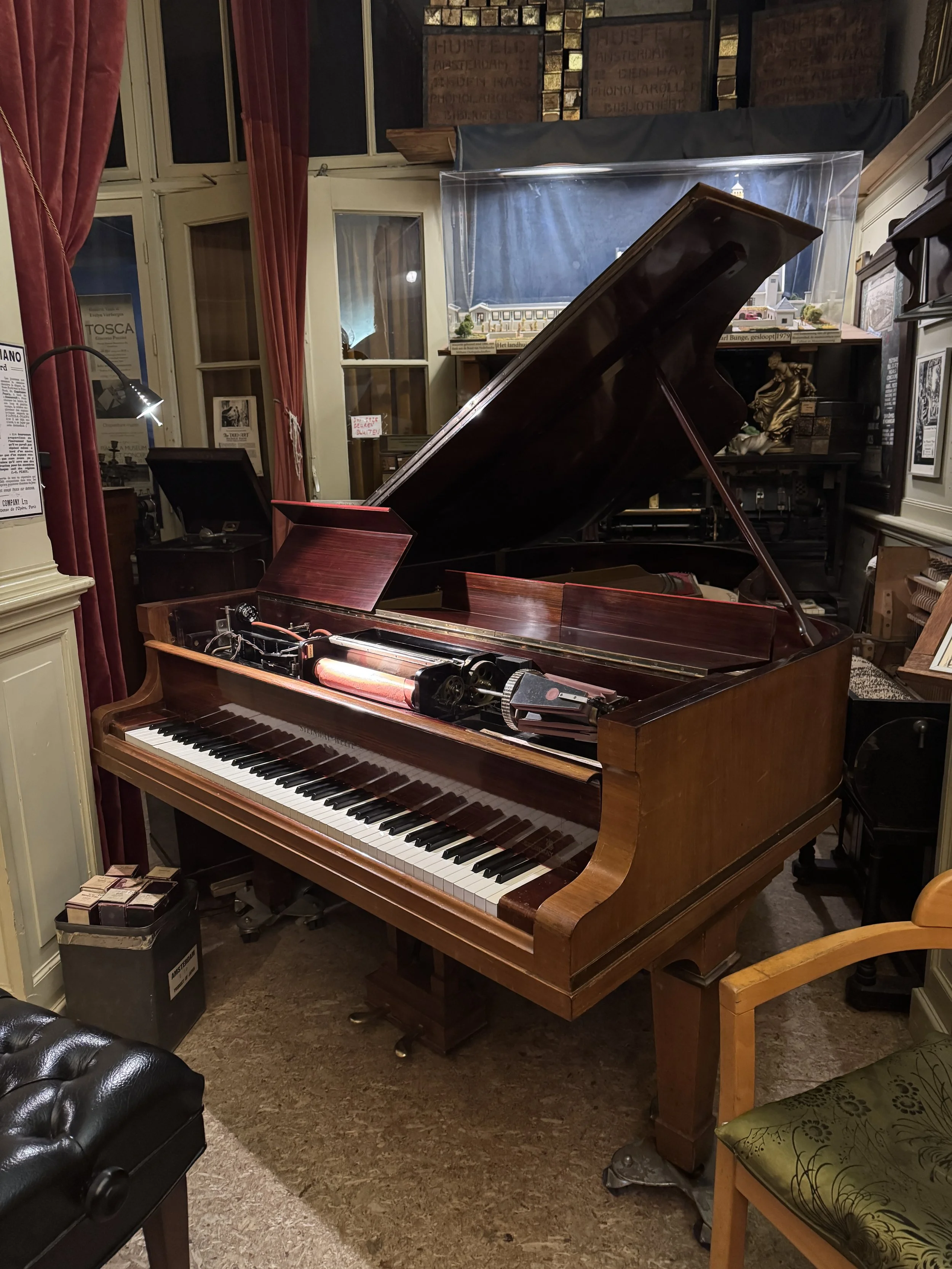 Historic grand piano on display inside Geelvinck Pianola Museum in Amsterdam