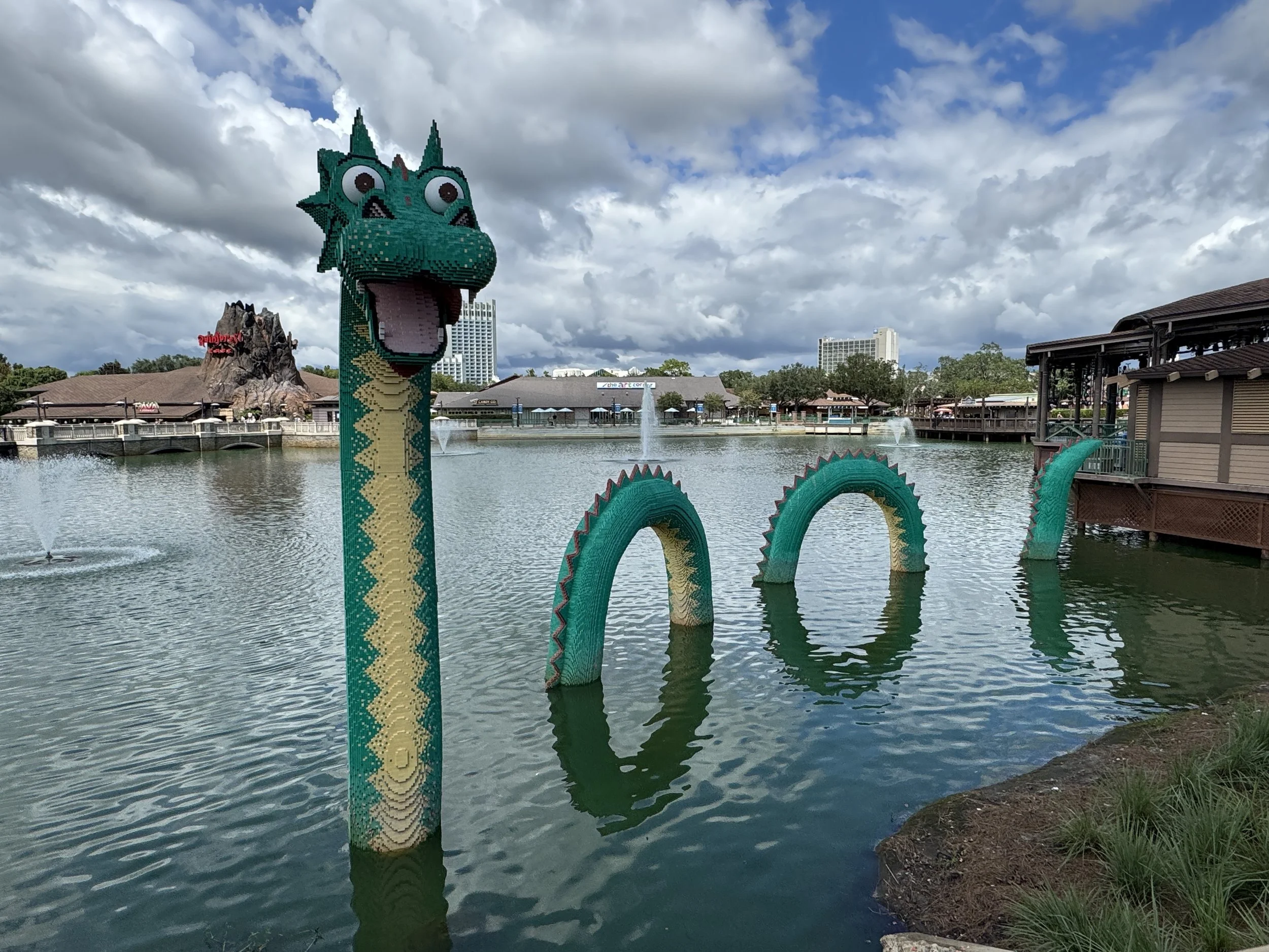 LEGO sea serpent sculpture rising from the water at Disney Springs.