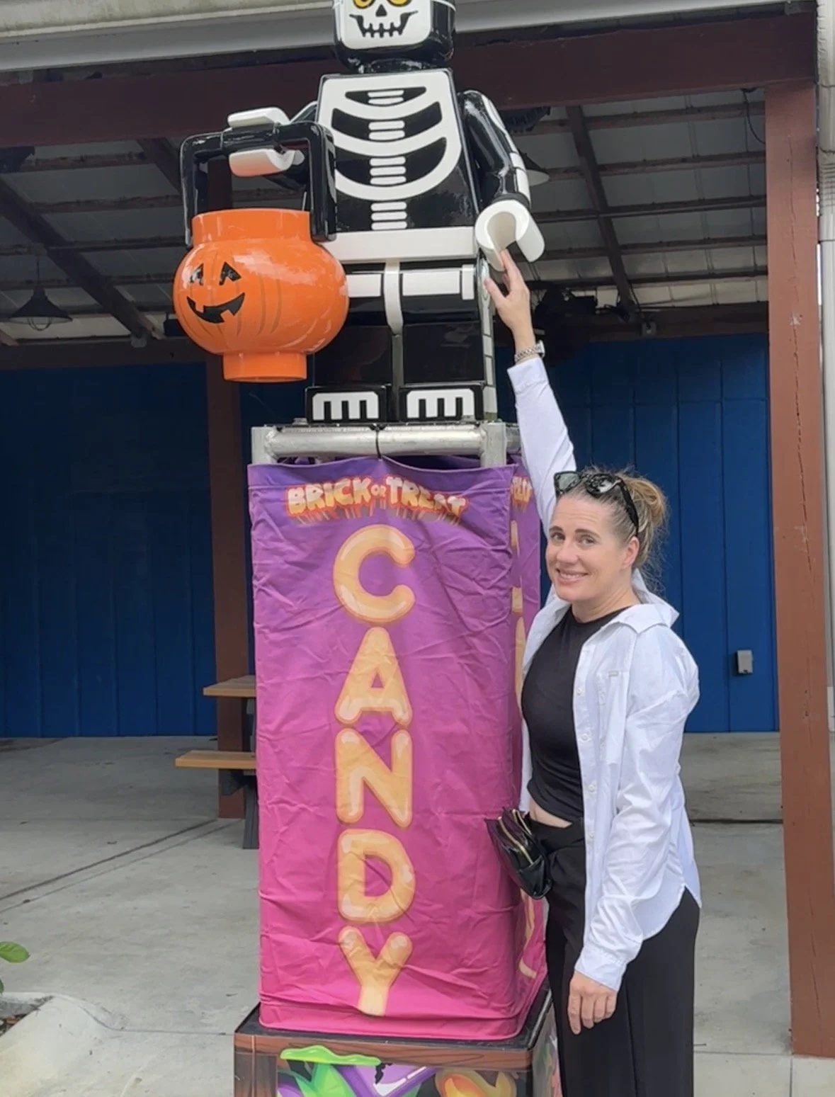 Halloween skeleton decoration holding a candy bucket at LEGOLAND Florida Resort.