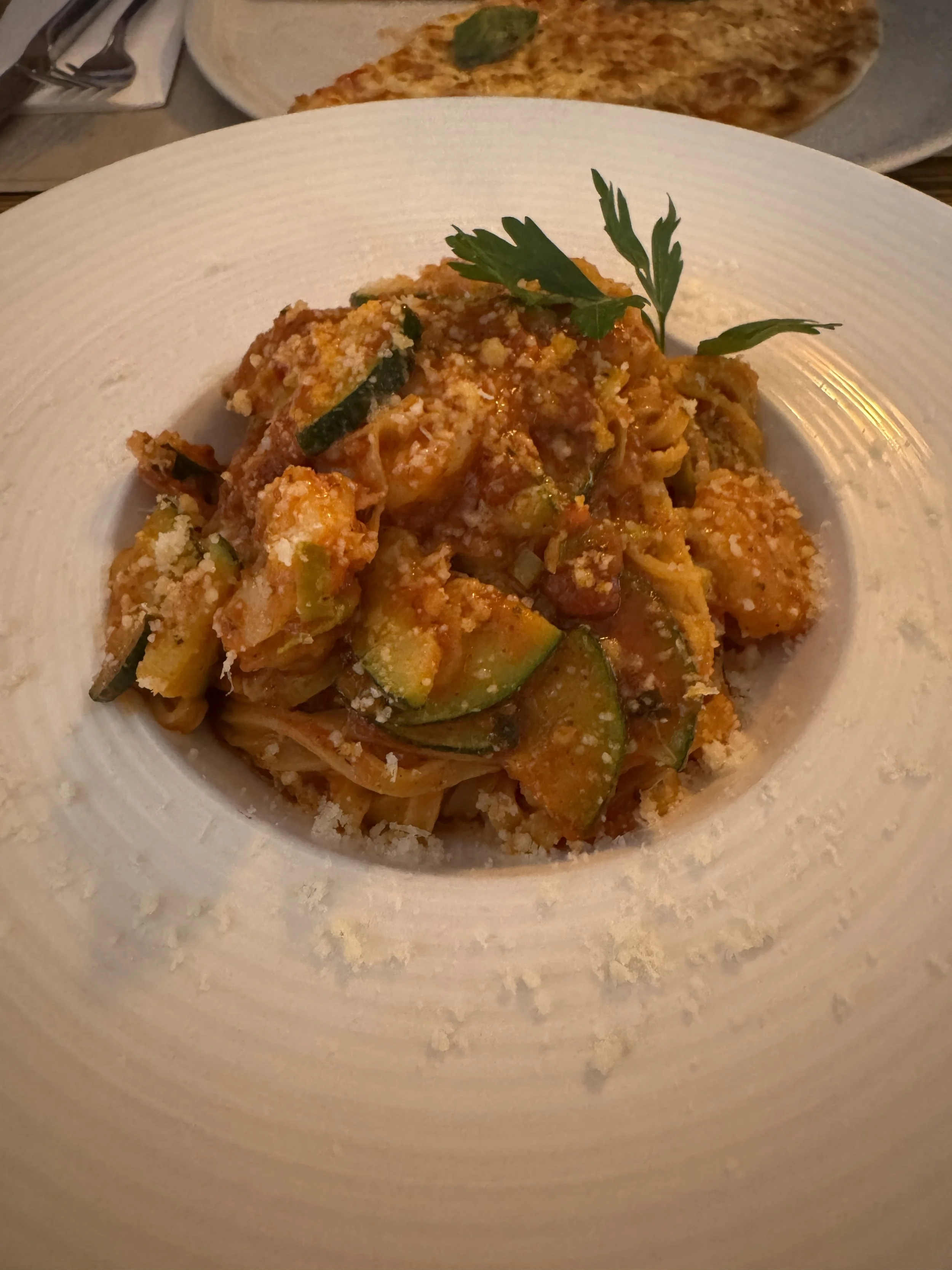 Shrimp and zucchini pasta in tomato sauce served at Café Piazza in Amsterdam