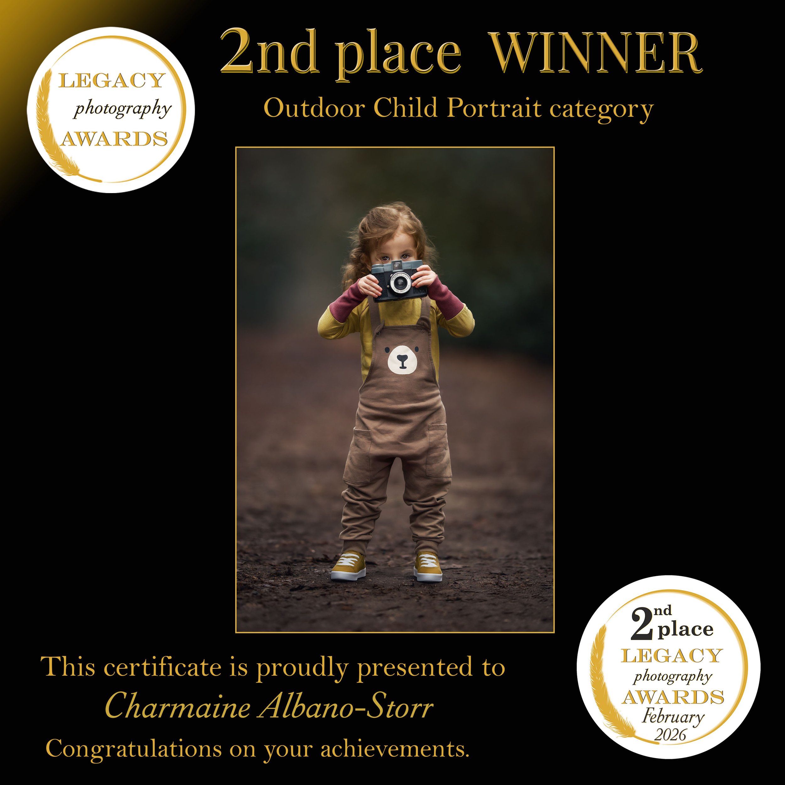 2nd place winner in the Legacy Photography Awards Outdoor Child Portrait category, featuring a young girl holding a camera during an outdoor photoshoot.
