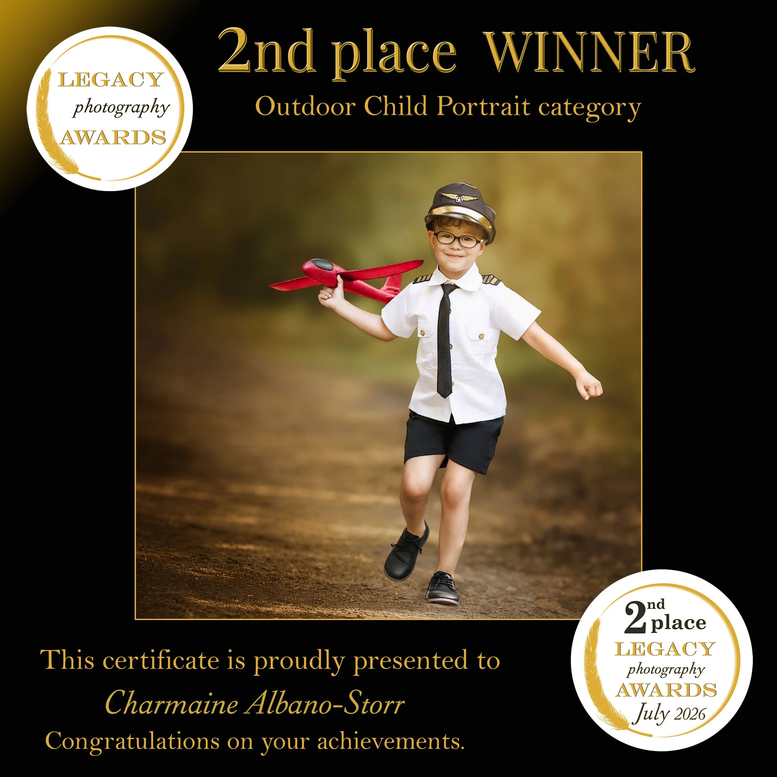2nd place winner in the Legacy Photography Awards Outdoor Child Portrait category, featuring a young boy dressed as a pilot running with a red toy aeroplane.
