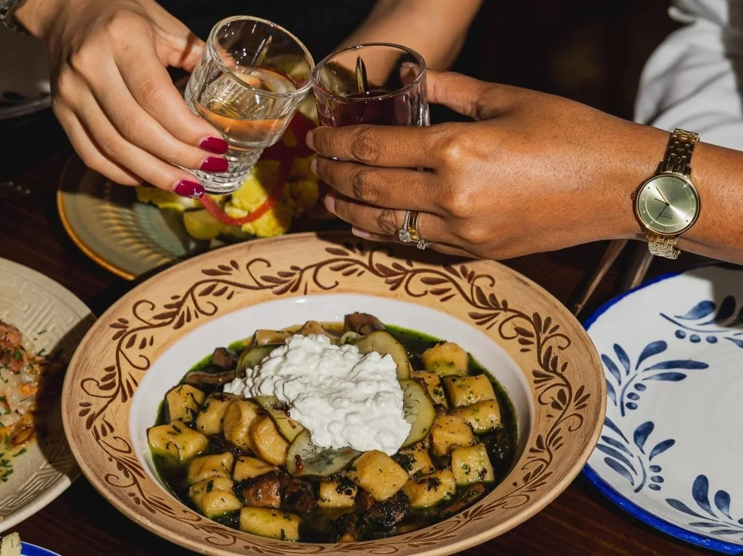 Happy Hour at Kyiv Social Chippendale, cheersing drinks over the table