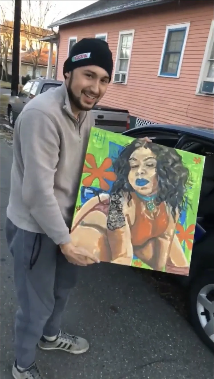 Collector holding a colorful portrait of a woman