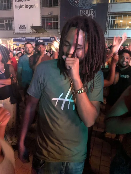 Haze Haywood laughing at a live painting event