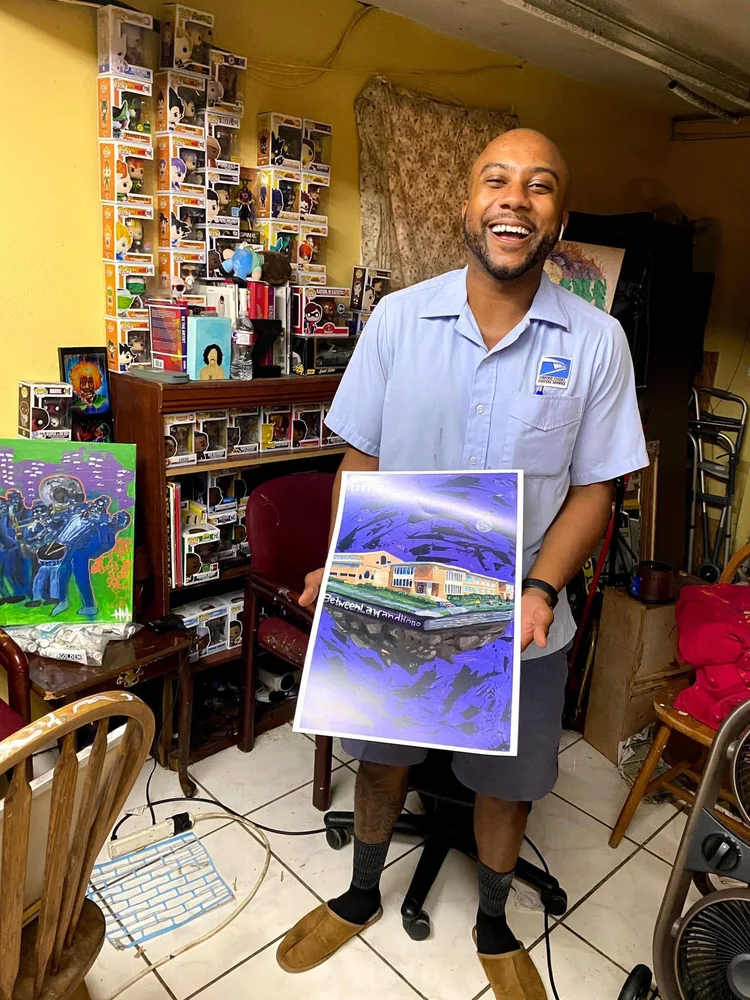 Collector smiling with a painting in his home