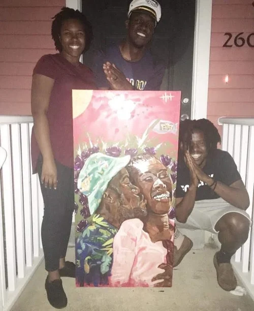 Family on their porch with a commissioned family portrait