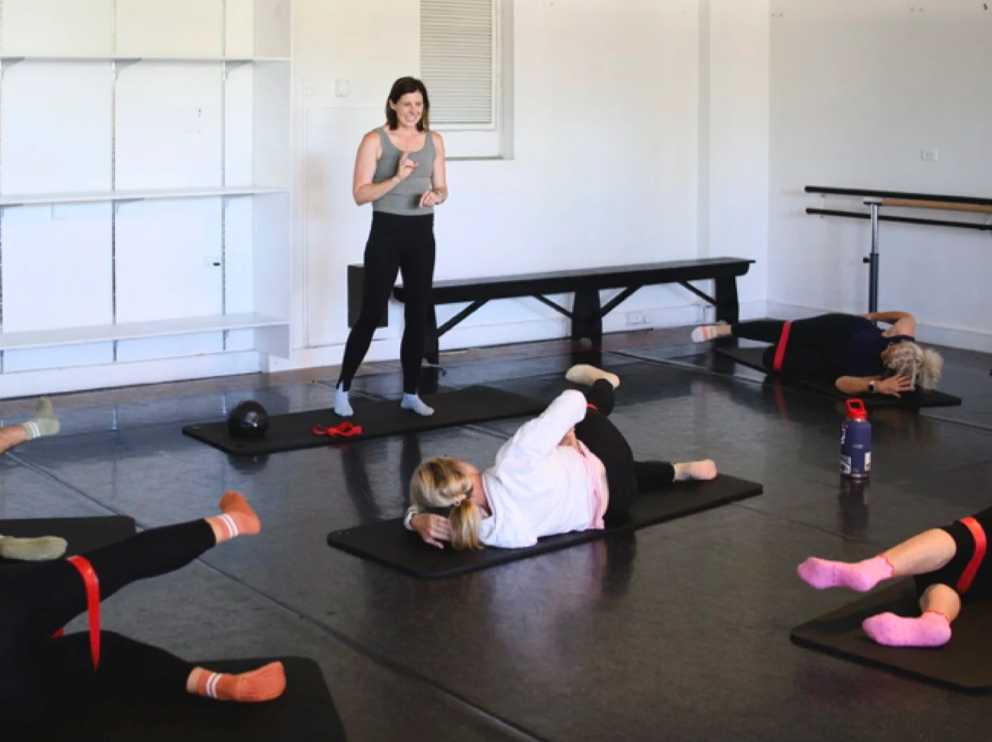 Claudia instructing a pilates class