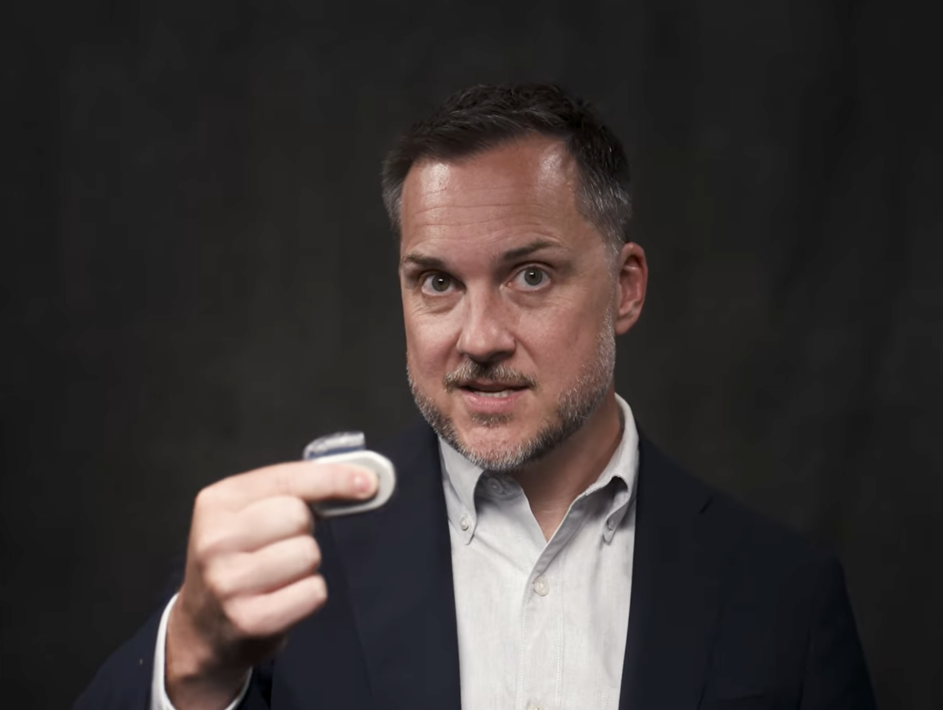 Dr. Ryan Nord holds an Inspire pulse generator, the implantable device used in hypoglossal nerve stimulation therapy for obstructive sleep apnea.