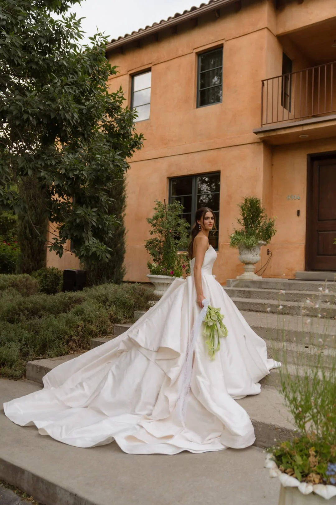 Utah bride holding a bridal bouquet designed by Salt Lake wedding florist, Sprigs of Love.